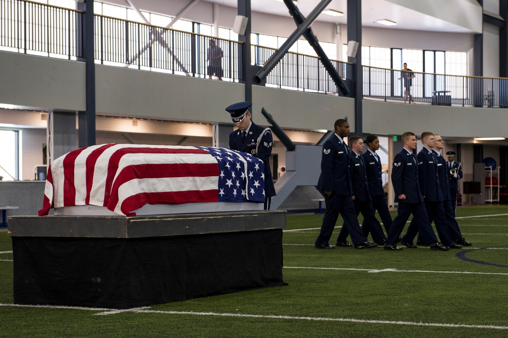 Members of the base honor guard team perform a mock military funeral with honors Feb. 7, 2014, Eielson Air Force Base, Alaska. Twelve new members completed 40 hours of training which included pall bearing, firing team, colors, proper wear of the ceremonial dress and the importance of military customs and courtesies. (U.S. Air Force photo by Senior Airman Joshua Turner/Released)
