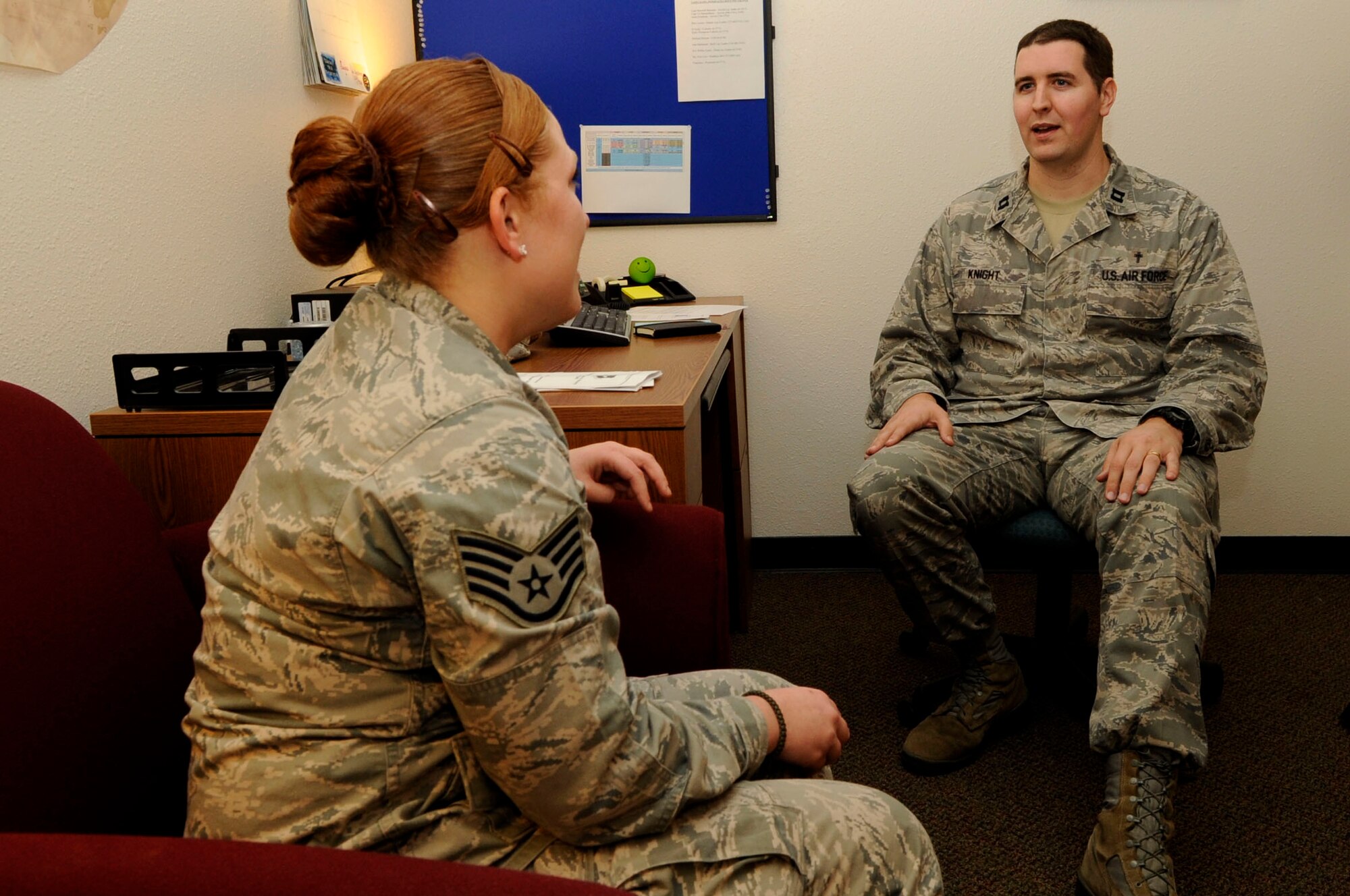 VANDENBERG AIR FORCE BASE, Calif. -- Capt. Matthew Knight, 30th Space Wing chaplain, chats with Staff Sgt. Bambi White, 30th Security Forces Squadron unit scheduler here, Feb. 11. The VAFB chapel has recently integrated four of its five chaplains into the wings’ four groups, physically relocating their offices to better assist when needed. (U.S. Air Force photo/ Senior Airman Shane Phipps)

