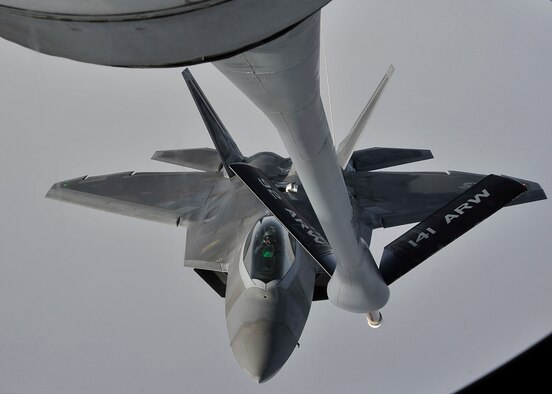An F-22 Raptor from Hill Air Force Base, Utah, prepares to be refueled by a KC-135 Stratotanker assigned to Fairchild AFB, Wash., Feb. 7, 2014. The KC-135 Stratotanker provides the core aerial refueling capability for the U.S. Air Force and has filled this role for more than 50 years. (U.S. Air Force photo/Senior Airman Mary O'Dell)
