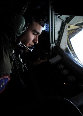 Airman 1st Class Jordan Gese, a 93rd Air Refueling Squadron boom operator, reviews checklists before refueling another aircraft mid-air, Feb. 7, 2014. The KC-135 Stratotanker can carry a maximum of 200,000 pounds of fuel to transfer at any given time. (U.S. Air Force photo/Senior Airman Mary O'Dell)