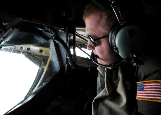 Staff Sgt. Jason Markham, 93rd Air Refueling Squadron boom operator, prepares to refuel a B-52H Stratofortress during a routine training mission over North Dakota, Feb. 6, 2014. The basic crew of a KC-135 Stratotanker includes a pilot, co-pilot and boom operator. The B-52H Stratofortess is assigned to the 5th Bomb Wing at Minot AFB, N.D. (U.S. Air Force photo/Senior Airman Mary O'Dell)