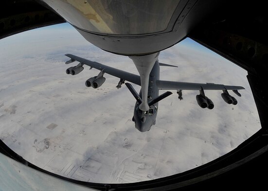 A B-52H Stratofortess, assigned to the 5th Bomb Wing at Minot Air Force Base, N.D., is refueled by a KC-135 Stratotanker from the 92nd Air Refueling Wing at Fairchild Air Force Base, Wash., Feb. 6, 2014. The KC-135 can transfer up to 200,000 pounds of fuel and can carry up to 83,000 pounds of cargo. (U.S. Air Force photo/Senior Airman Mary O'Dell)
