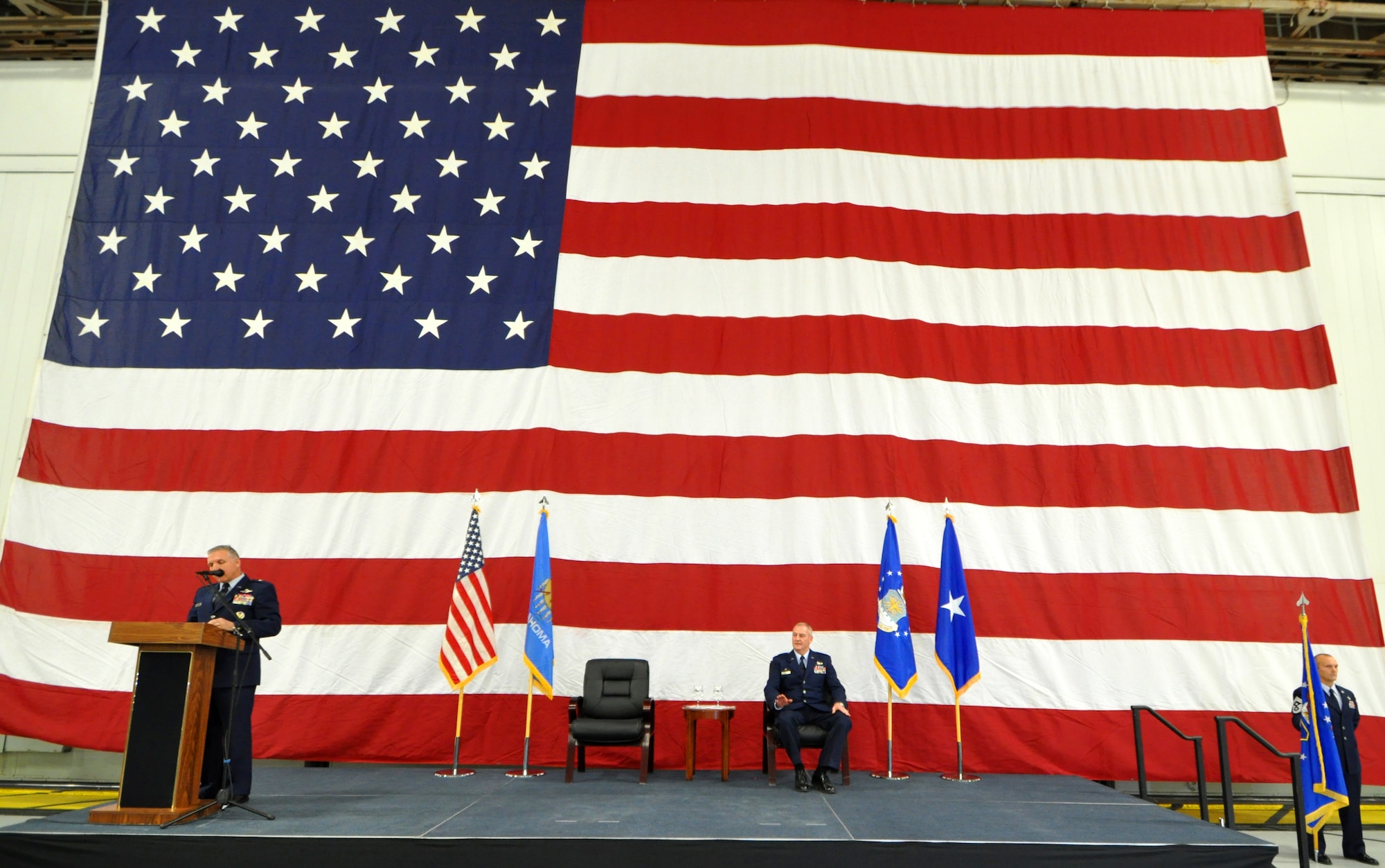 Brigadier General John C. Flournoy Jr., 4th Air Force commander talks about the experience and leadership of Col. Brian S. Davis, sitting, during the 507th Air Refueling Wing assumption of command ceremony Feb. 8, 2014 here.  Davis comes to the 507th from the 459th Air Refueling Wing where he served as Operations Group commander for two years.  (U.S. Air Force photo/Senior Airman Mark Hybers)