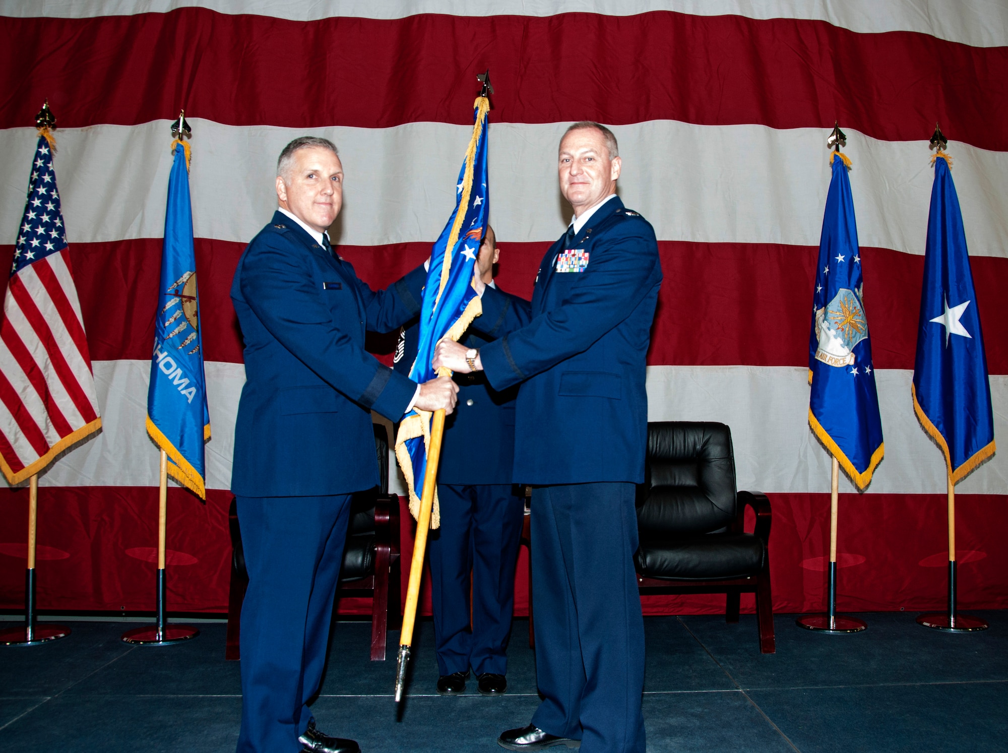 Colonel Brian S. Davis, right, assumes command of the 507th Air Refueling Wing during a ceremony at Tinker Air Force Base Feb. 8, 2014.  Brigadier General John C. Flournoy Jr., 4th Air Force commander presided over the proceedings.  Davis comes to the 507th from the 459th Air Refueling Wing where he served as Operations Group commander for two years.  (U.S. Air Force photo/Senior Airman Mark Hybers)