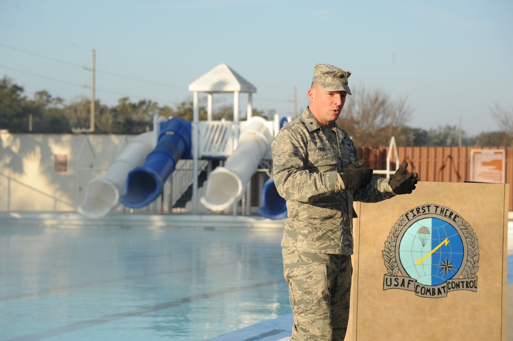 Brig. Gen. Patrick Higby, 81st Training Wing commander, provides remarks during the heated triangle pool ribbon cutting ceremony Feb. 7, 2014, at Keesler Air Force Base, Miss.  The heated pool will allow Keesler’s battlefield Airmen students the ability to execute water skills training without impeding on the limited time the students have in the morning for physical training before starting their academic day.  Prior to the heater being installed, the Airmen had to use an off base facility.  (U.S. Air Force photo by Kemberly Groue)