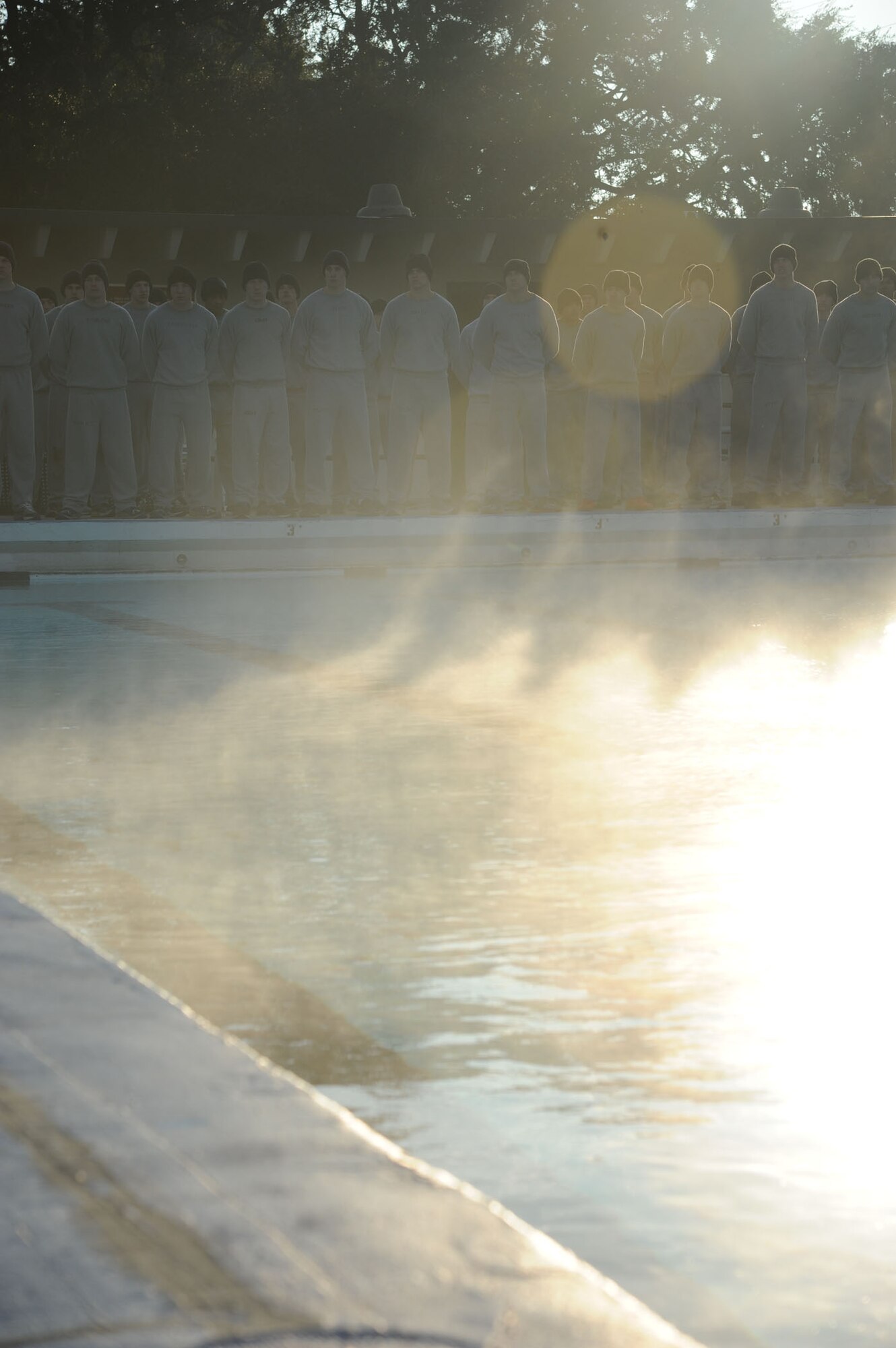 Combat Control Airmen from the334th Training Squadron stand near the edge of the newly heated triangle pool facility prior to the ribbon cutting ceremony Feb. 7, 2014, at Keesler Air Force Base, Miss.  The heated pool will allow Keesler’s battlefield Airmen students the ability to execute water skills training without  impeding on the limited time the students have in the morning for physical training before starting their academic day.  Prior to the heater being installed, the Airmen had to use an off base facility.  (U.S. Air Force photo by Kemberly Groue)