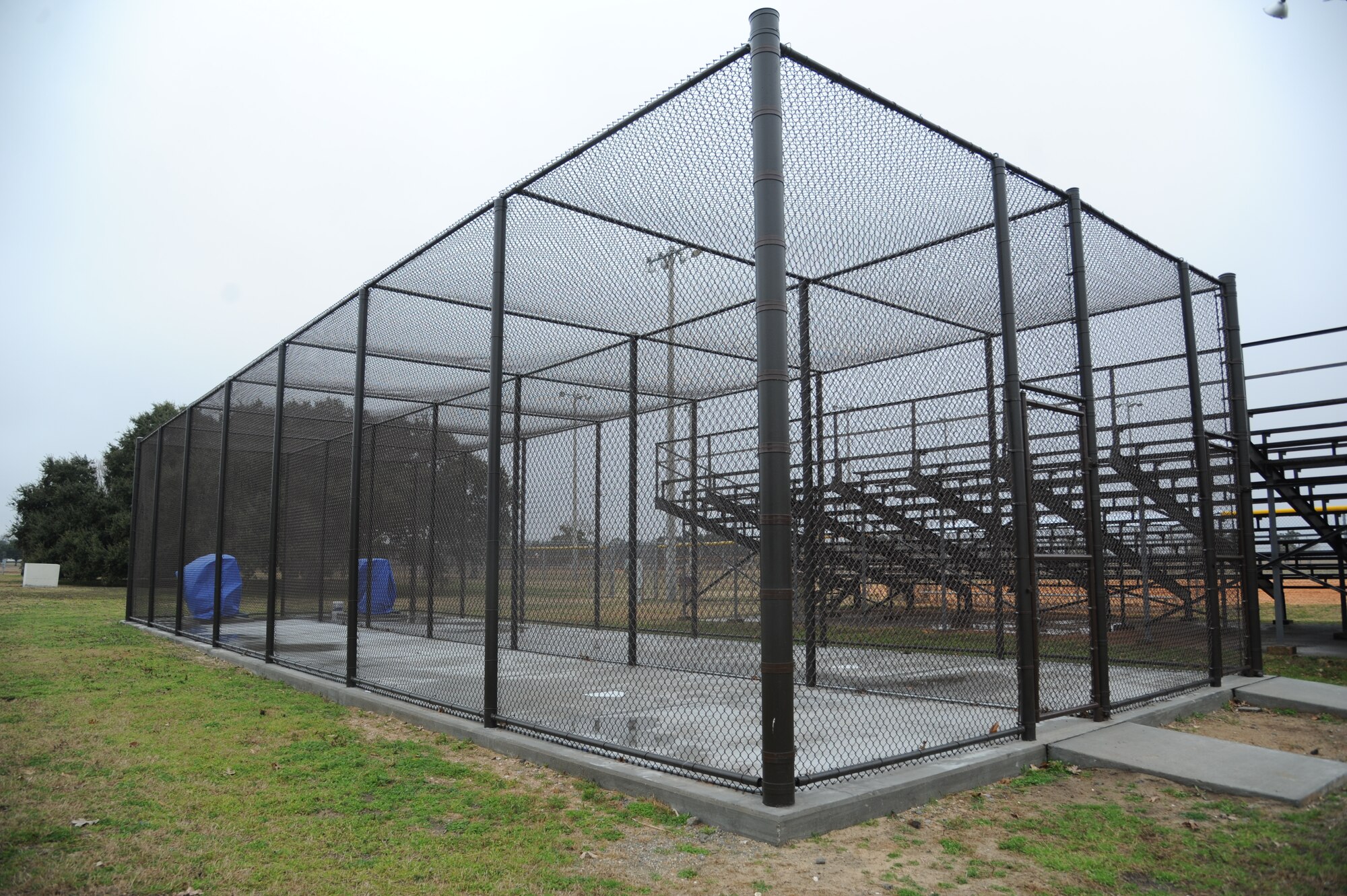 Batting cages sit behind the softball fields on Ploesti Drive with equipment inside for free use by anyone Feb. 11, 2014, at Keesler Air Force Base, Miss.  The batting cages are one of the Commander-in-Chief’s Installation Excellence Award projects.  (U.S. Air Force photo by Kemberly Groue)