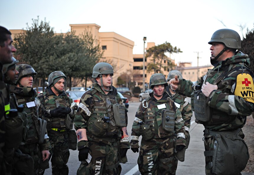 Tech. Sgt. Daniel Thetford, 51st Medical Operations Squadron Emergency Room NCO in charge and Wing Inspection Team member, briefs a group of role players prior to a mass casualty scenario outside Bldg. 938 during Operational Readiness Exercise Beverly Midnight 14-02 at Osan Air Base, Republic of Korea, Feb. 11, 2014. Each Airman was given a set of physical and/or mental injuries to portray as a result of indirect fire on Bldg. 938. (U.S. Air Force photo/Airman 1st Class Ashley J. Thum)