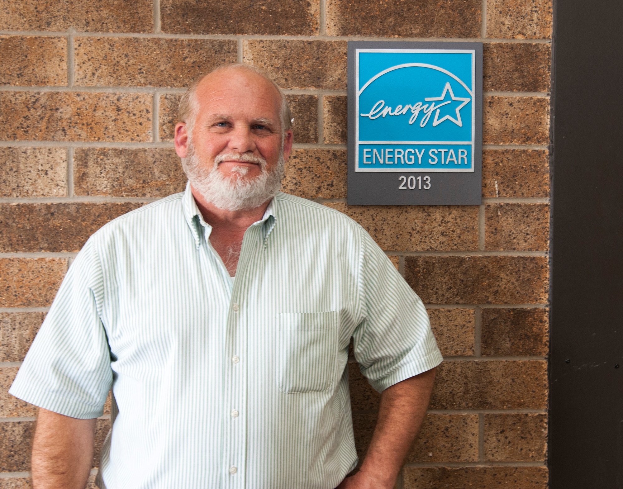Dale Boutwell, 47th Medical Group facilities manager, stands by the ENERGY STAR plaque at the 47th MDG facility at Laughlin Air Force Base, Texas, Feb. 11, 2014. The ENERGY STAR plaque and label signifies an energy-efficient facility that saves money without sacrificing performance. (U.S. Air Force photo/2nd Lt. William M. Tyrrell)
