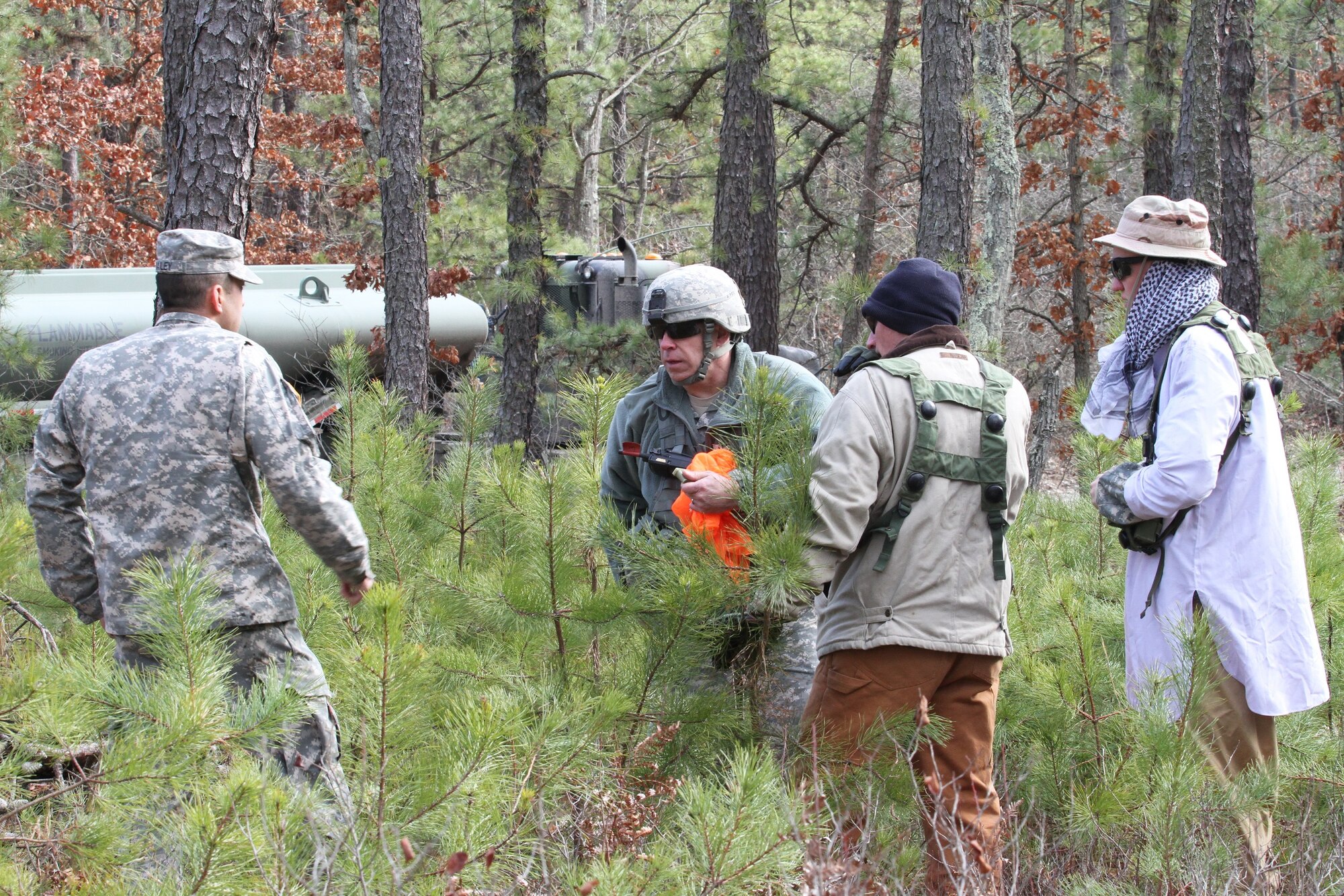 After a simulated attack, members of the OPFOR along with an observer controller/trainer do an after action review during the 78th Training Division's 2014 WAREX at Joint Base McGuire-Dix-Lakehurst, N.J., Jan. 18, 2014. (U.S. Army photo by Spc. Phillip Scaringi/Released)