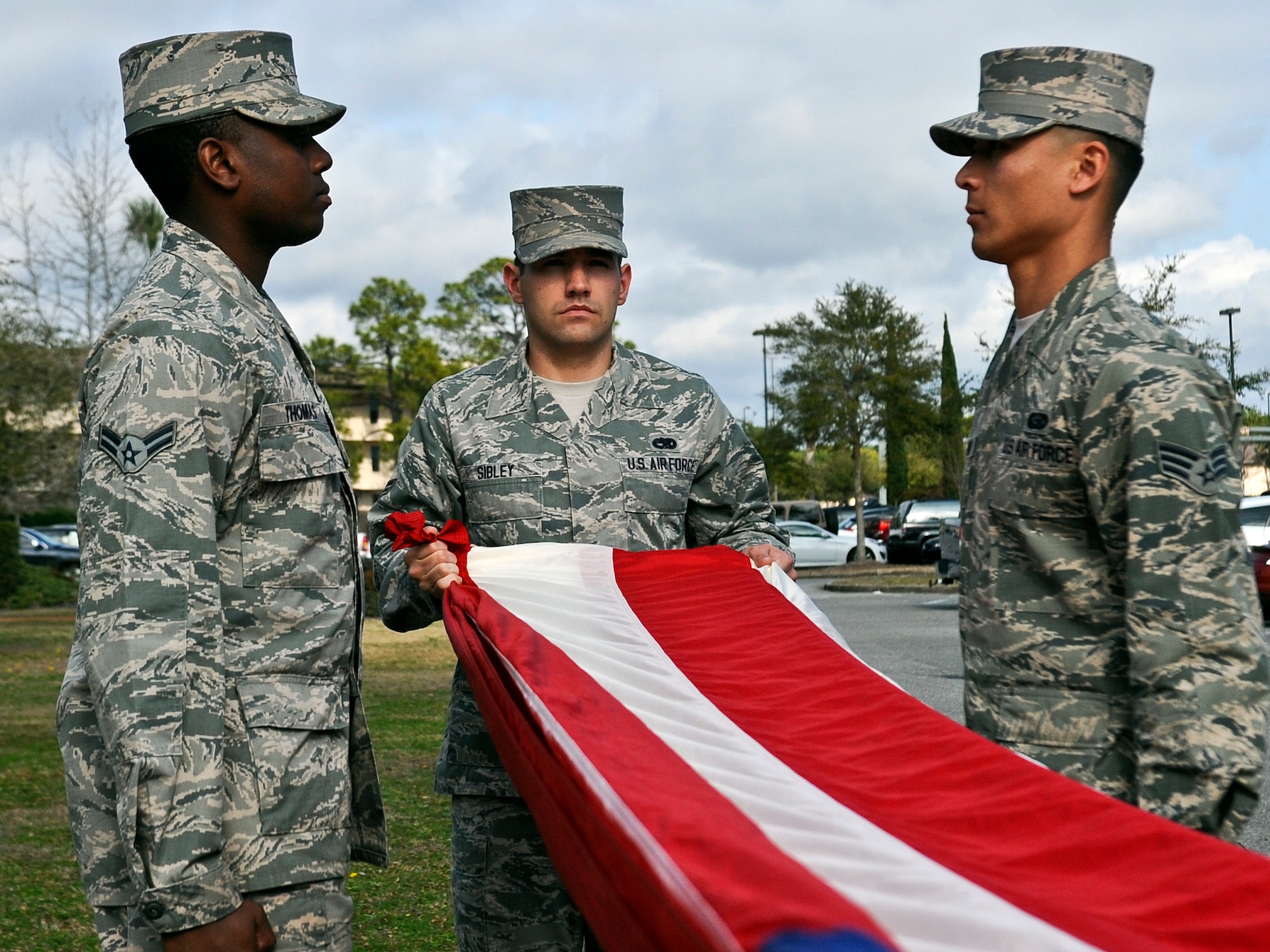 Hurlburt Field honor guardsmen practice performing a retreat ceremony on Hurlburt Field, Fla., Feb. 10, 2014. The base honor guard trains Airmen who perform the weekly retreat ceremony at the wing headquarters’ flagpole. (U.S. Air Force photo/Senior Airman Michelle Vickers)