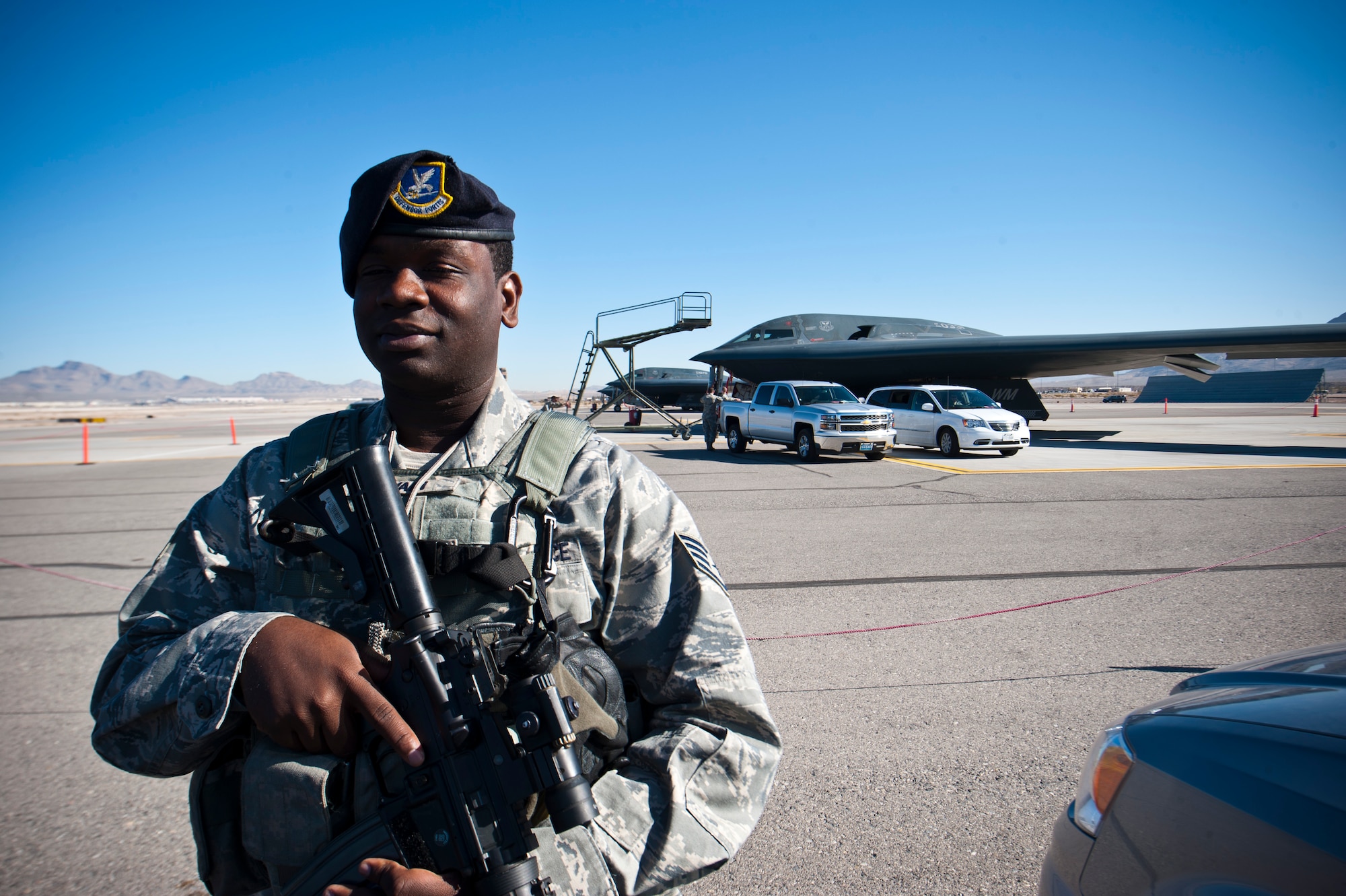 U.S. Air Force Staff Sgt. James Bovain, 509th Security Forces Squadron response force leader from Whiteman Air Force Base, Mo., stands guard at an entry control point on the flightline during Red Flag 14-1 Feb. 10, 2014, at Nellis AFB, Nev. The 13th Bomb Squadron, from Whiteman AFB, brought defenders from their home base since they’re accustomed to the specific guidelines of monitoring the B-2 and surrounding area. (U.S. Air Force photo by Airman 1st Class Thomas Spangler) 