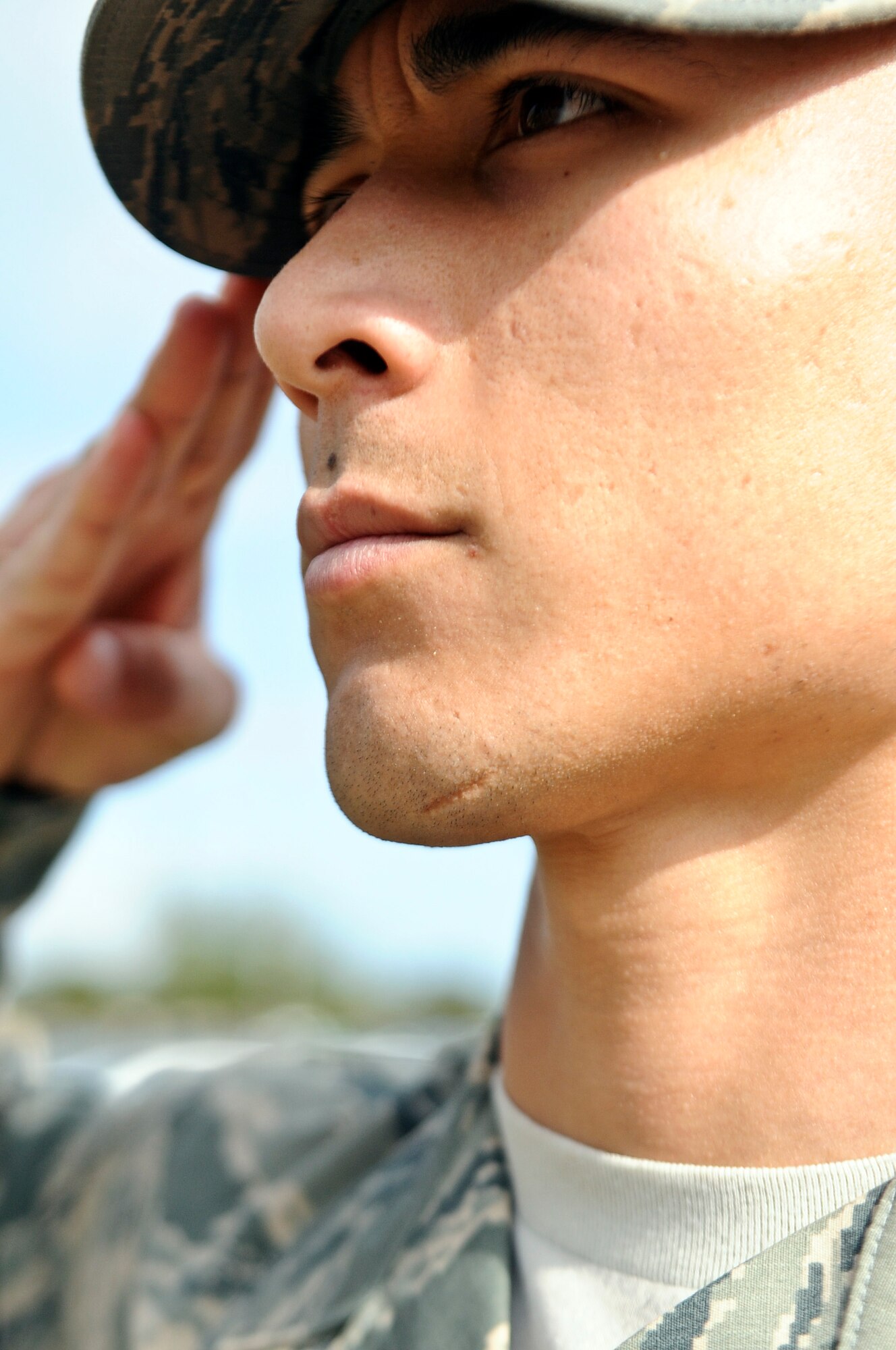 Senior Airman Shokhrukh Dadajanov, Hurlburt Field honor guardsman, renders a salute during a retreat ceremony on Hurlburt Field, Fla., Feb. 10, 2014. Military members in uniform should assume the position of attention and salute when the national anthem plays. (U.S. Air Force photo/Senior Airman Michelle Vickers)