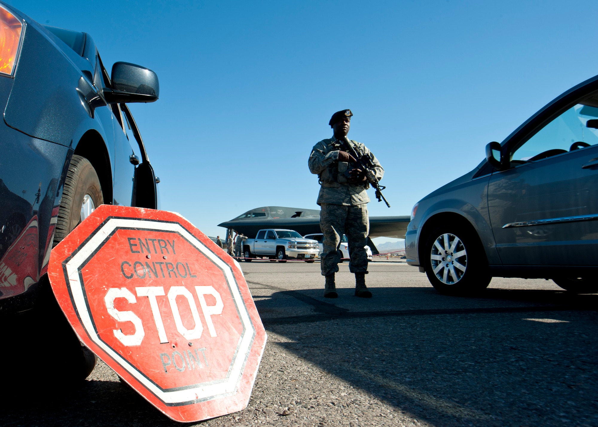 U.S. Air Force Staff Sgt. James Bovain, 509th Security Forces Squadron response force leader from Whiteman Air Force Base, Mo., stands guard at an entry control point on the flightline during Red Flag 14-1 Feb. 10, 2014, at Nellis AFB, Nev. The 13th Bomb Squadron, from Whiteman AFB, brought defenders from their home base since they’re accustomed to the specific guidelines of monitoring the B-2 and surrounding area. (U.S. Air Force photo by Airman 1st Class Thomas Spangler) 