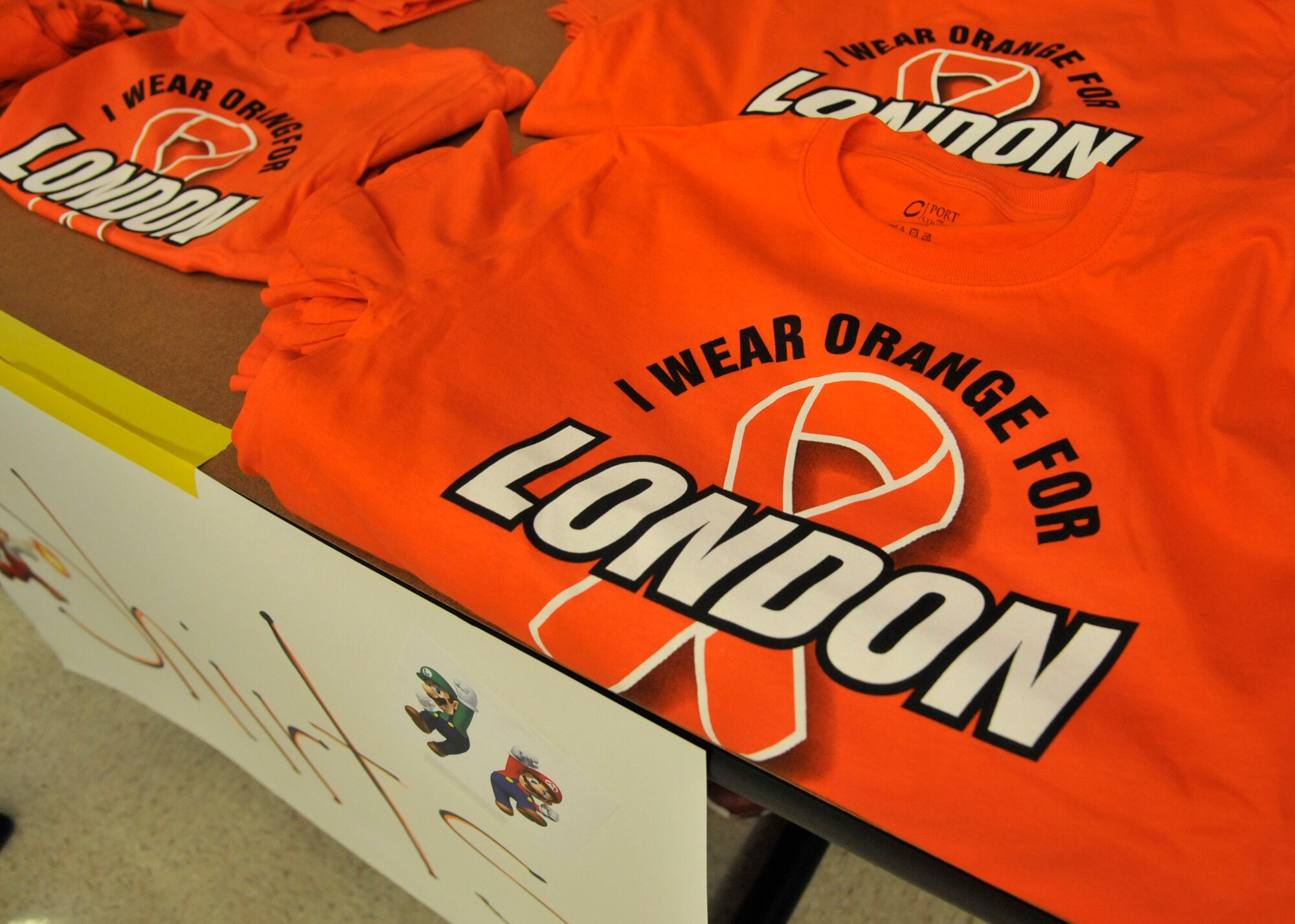 An event held at Michael Anderson Elementary School was hosted in honor of London Bowater, a first-grader who was diagnosed with Acute Lymphoblastic Leukemia in February 2012 at Fairchild Air Force Base, Wash., Feb. 1, 2014. Many members of the Fairchild and local community supplied auctionable items for members to bid on, sold t-shirts, food and drinks, with all proceeds donated directly to London's family. (U.S. Air Force photo by Senior Airman Mary O'Dell/Released)