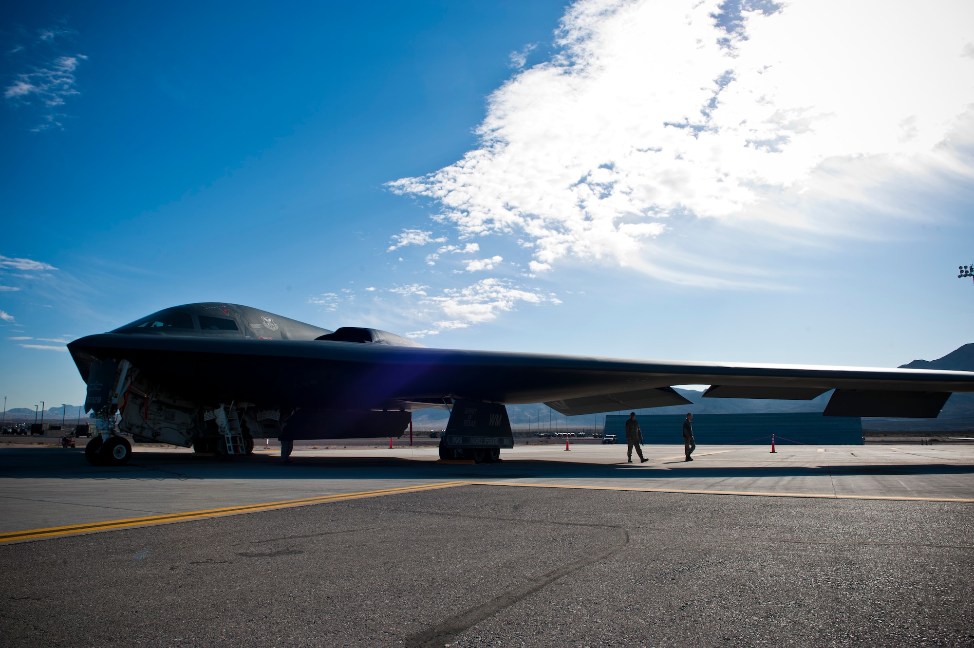 A U.S. Air Force B-2 Spirit assigned to the 13th Bomb Squadron from Whiteman Air Force Base, Mo., gets inspected by ground crews during Red Flag 14-1 Feb. 10, 2014, at Nellis AFB, Nev. The B-2 is the only aircraft in the world of its kind, bringing unmatched long-range, precision-strike capability options to combatant commanders around the world. Red Flag gives air and ground crews the opportunity to experience realistic combat scenarios they may find in a future real-world environment. (U.S. Air Force photo by Airman 1st Class Thomas Spangler)