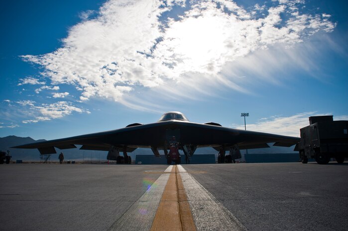 A U.S. Air Force B-2 Spirit assigned to the 13th Bomb Squadron from Whiteman Air Force Base, Mo., gets inspected by ground crews during Red Flag 14-1 Feb. 10, 2014, at Nellis AFB, Nev. The B-2 is the only aircraft in the world of its kind, bringing unmatched long-range, precision-strike capability options to combatant commanders around the world. Red Flag gives air and ground crews the opportunity to experience realistic combat scenarios they may find in a future real-world environment. (U.S. Air Force photo by Airman 1st Class Thomas Spangler)