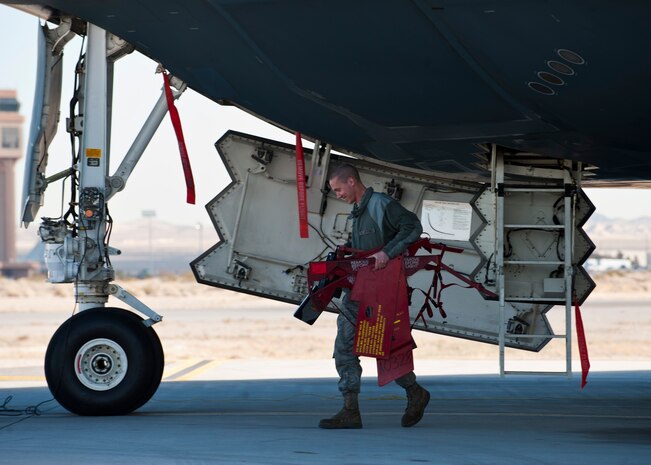 U.S. Air Force Senior Airman Eric Pope, 509th Aircraft Maintenance Squadron crew chief from Whiteman Air Force Base, Mo., prepares a B-2 Spirit for flight during Red Flag 14-1 Feb. 10, 2014, at Nellis AFB, Nev. At Red Flag, the B-2 has participated in exercises alongside other combat aircraft including the F-22, F-16, F-15, as well as those from the United Kingdom and Australia. (U.S. Air Force photo by Airman 1st Class Thomas Spangler)