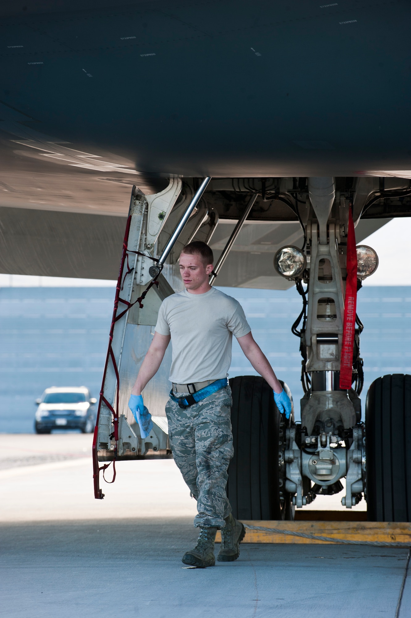 U.S. Air Force Senior Airman Dustin Childs, 509th Aircraft Maintenance Squadron crew chief from Whiteman Air Force Base, Mo., finishes cleaning the landing gear doors of a B-2 Spirit during Red Flag 14-1 Feb. 10, 2014, at Nellis AFB, Nev. The B-2 is a low-observable bomber aircraft capable of releasing conventional and nuclear ordinances. Red Flag is an exercise that gives air and ground crews from various squadrons, branches and allied nations the chance to come together and practice various combat scenarios in a controlled environment. (U.S. Air Force photo by Airman 1st Class Thomas Spangler)