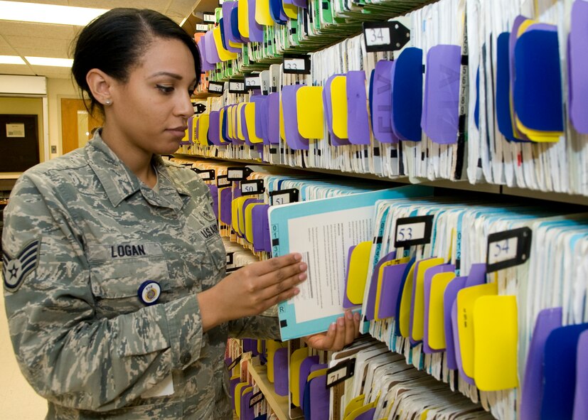 Staff Sgt. Tiffany Logan, 436th Dental Squadron dental assistant, sorts through dental records inside the Dental Clinic Feb. 10, 2014, at Dover Air Force Base, Del. Logan won the 2013 Air Mobility Command Outstanding Dental Non-Commissioned Officer of the Year. (U.S. Air Force photo/Airman 1st Class Zachary Cacicia)
