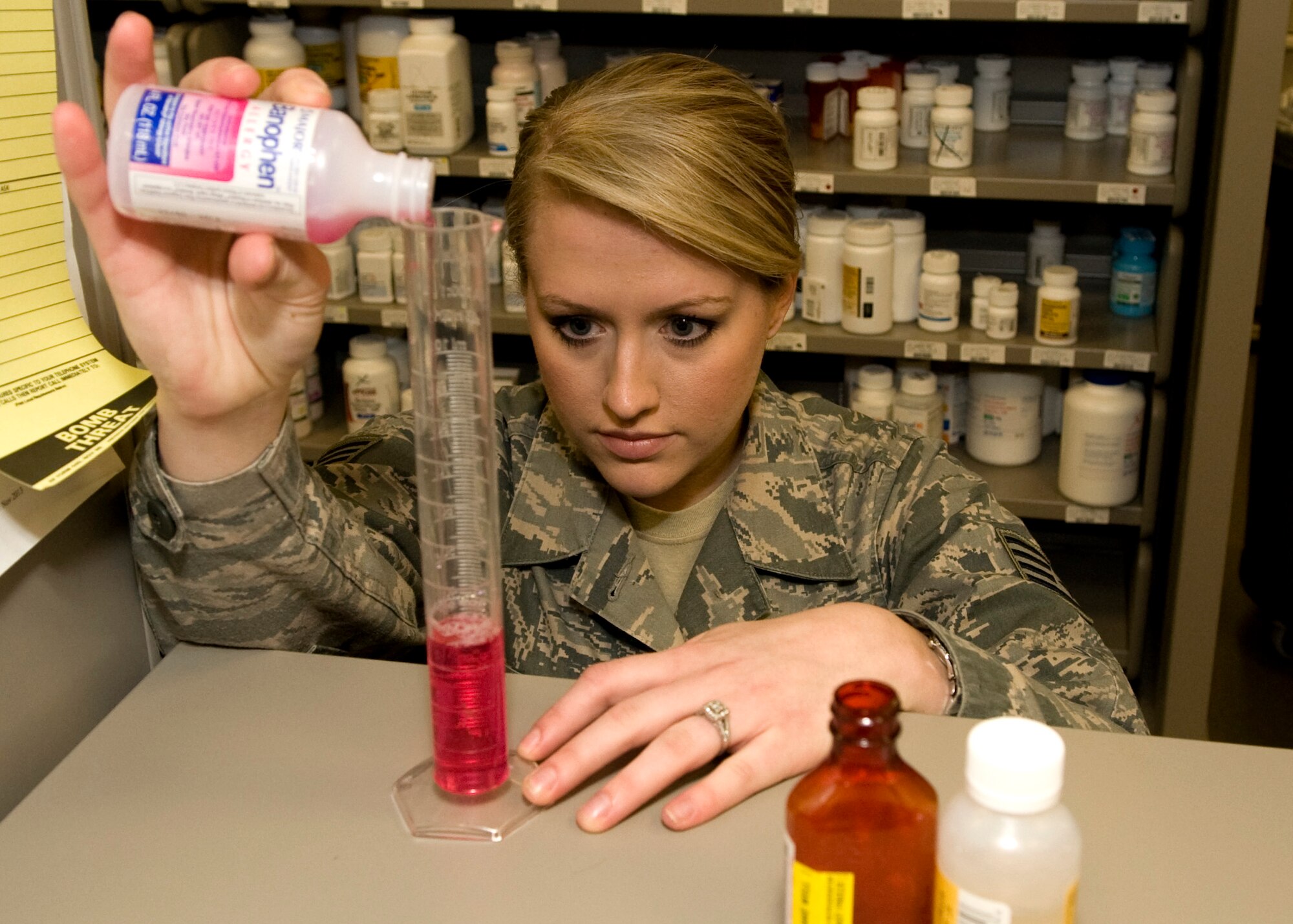 Staff Sgt. Rhonda Russell, 436th Medical Support Squadron pharmacy technician, measures liquid medication Feb. 7, 2014, inside the pharmacy on Dover Air Force Base, Del. Russell won the 2013 Air Mobility Command Air Force Pharmacy Technician Airman of the Year. (U.S. Air Force photo/Airman 1st Class Zachary Cacicia)