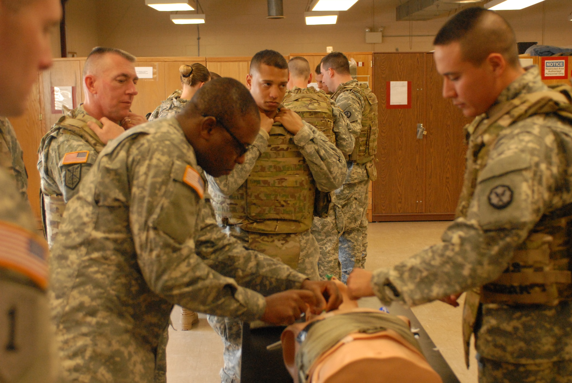 Sgt. Desmond Lanyo, 35, Cambridge, Mass. a combat lifesaver course student, performs a needle decompression for a tension pneumothorax (sucking chest wound) Jan. 24, 2014, at Joint Base McGuire-Dix-Lakehurst, N.J. Tension pneumothorax is the second leading cause of preventable battlefield death. The three-day course was designed to teach any Soldiers the basic medical skills needed to save lives in combat, when a Combat Medic isn't present. (U.S. Army photo by Capt. Kelvin Scott/Released)