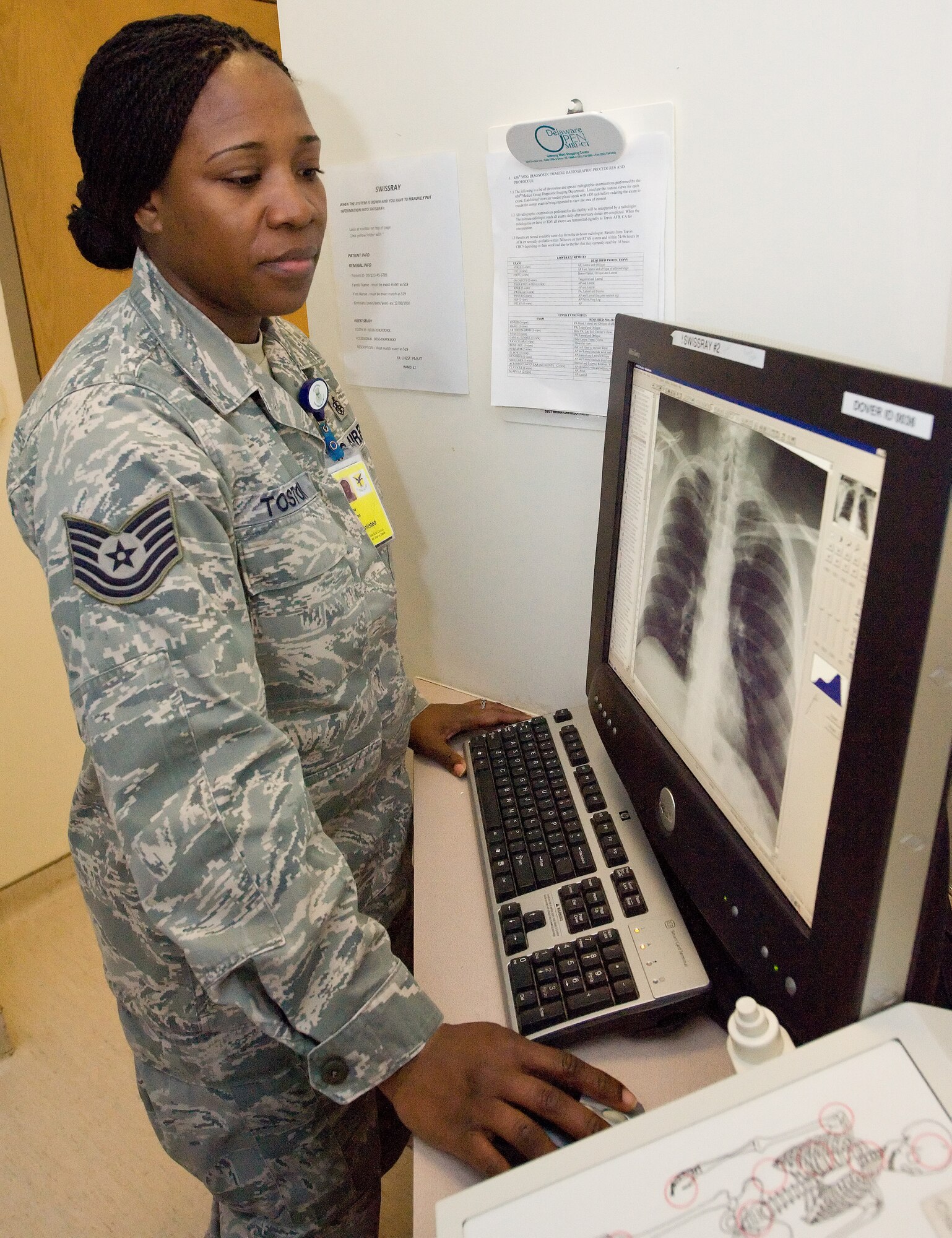 Tech. Sgt. Aisha Toston, 436th Medical Support Squadron diagnostics imaging technician, reviews a digital image Feb. 11, 2014, at the clinic on Dover Air Force Base, Del. Toston won the 2013 Air Mobility Command Outstanding Air Force Diagnostics Imaging Technician Noncommissioned Officer of the Year award. (U.S. Air Force photo/Roland Balik)
