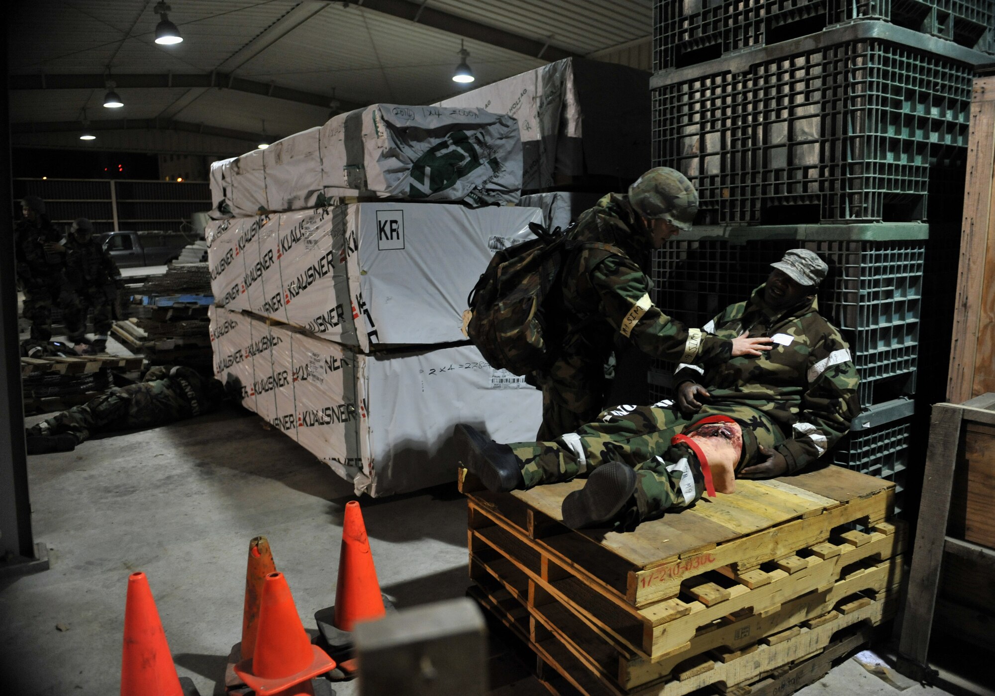 A member of the 51st Logistics Readiness Squadron Traffic Management Office triage team checks on the consciousness of a simulated explosion casualty during Beverly Midnight 14-02 at Osan Air Base, Republic of Korea, Feb. 11, 2014. The triage team was responsible for applying the proper medical care to each victim before transporting them to receive additional aid at the hospital. (U.S. Air Force photo/Senior Airman Siuta B. Ika)