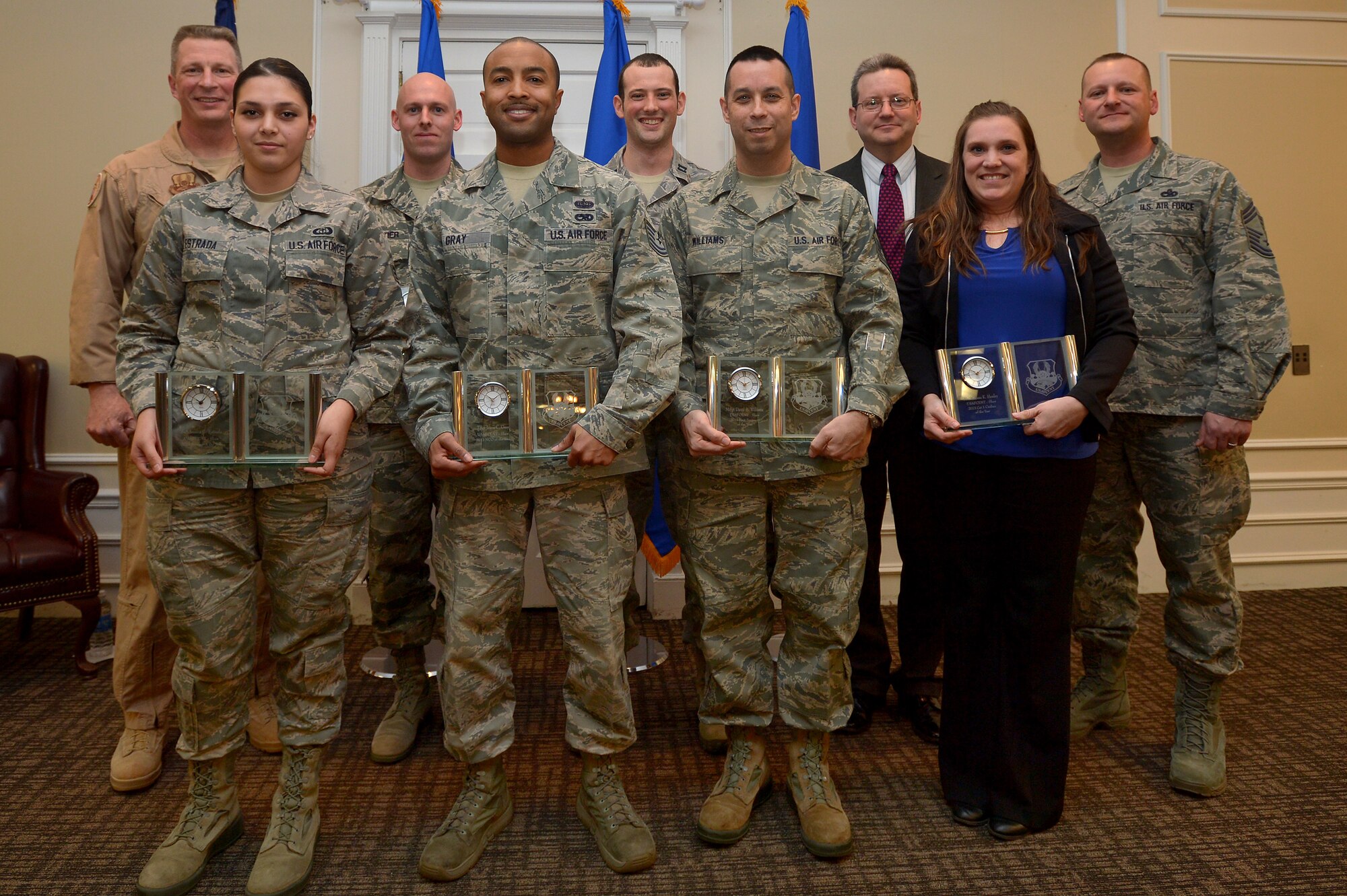 U.S. Air Forces Central Command Airmen and civilians pose for a group photo with Brig. Gen. John Dolan, USAFCENT assistant deputy commander (back left), and Chief Master Sgt. Antonio Brock, USAFCENT senior enlisted leader. (back right) after receiving annual awards at an award ceremony, Feb. 7, 2014, Shaw Air Force Base, S.C. The award winners were recognized for their work ethic and top achievements for 2013. (U.S. Air Force photo by Staff Sgt. Kenny Holston / Released)  