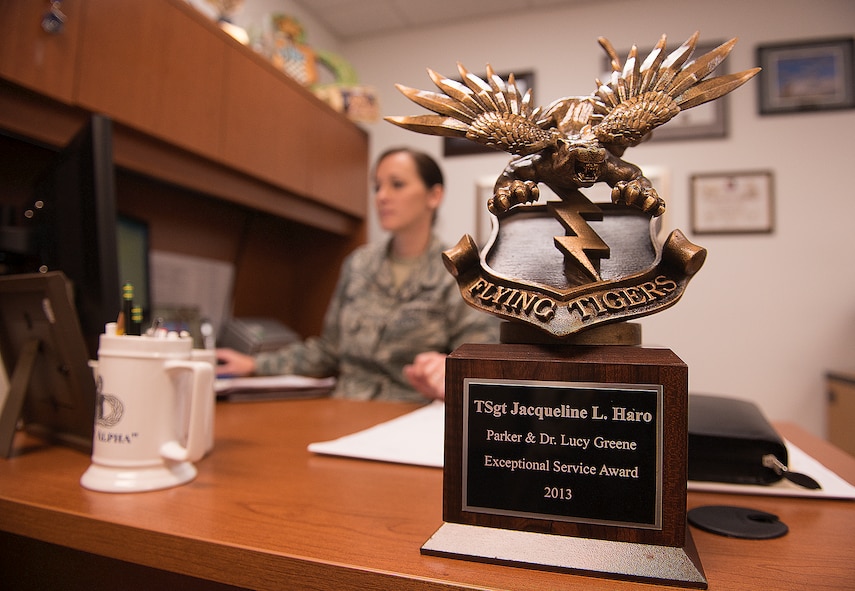 The Parker and Dr. Lucy Greene Exceptional Service Award sits on the desk of U.S. Air Force Tech. Sgt. Jacqueline Haro, 23d Maintenance Group maintenance training scheduler, at Moody Air Force Base, Ga., Feb. 6, 2014. Haro is the first recipient of the newly founded award. (U.S. Air Force photo by Senior Airman Tiffany M. Grigg/Released) 