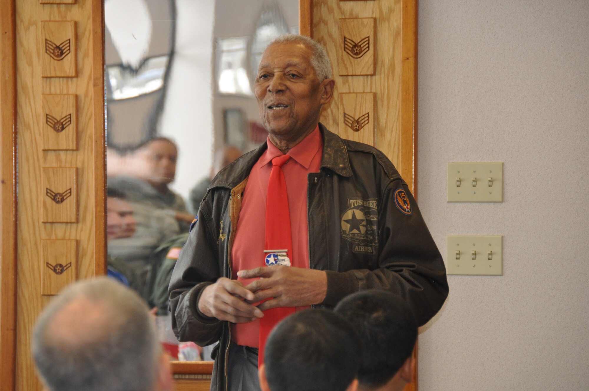 Ninety-three-year-old,Tech. Sgt. (Ret.) George Watson Sr., an original Tuskegee Airman, shares his military experience Feb. 7 as part of a mentoring luncheon sponsored by the 514th Air Mobility Wing Human Resource Development Council. The event was held at the Halverson Hall Dining Facility at Joint Base McGuire-Dix-Lakehurst, N.J., and is the first of a series of mentoring luncheons planned for 2014. (U.S. Air Force photo/Master Sgt. Donna T. Jeffries) 