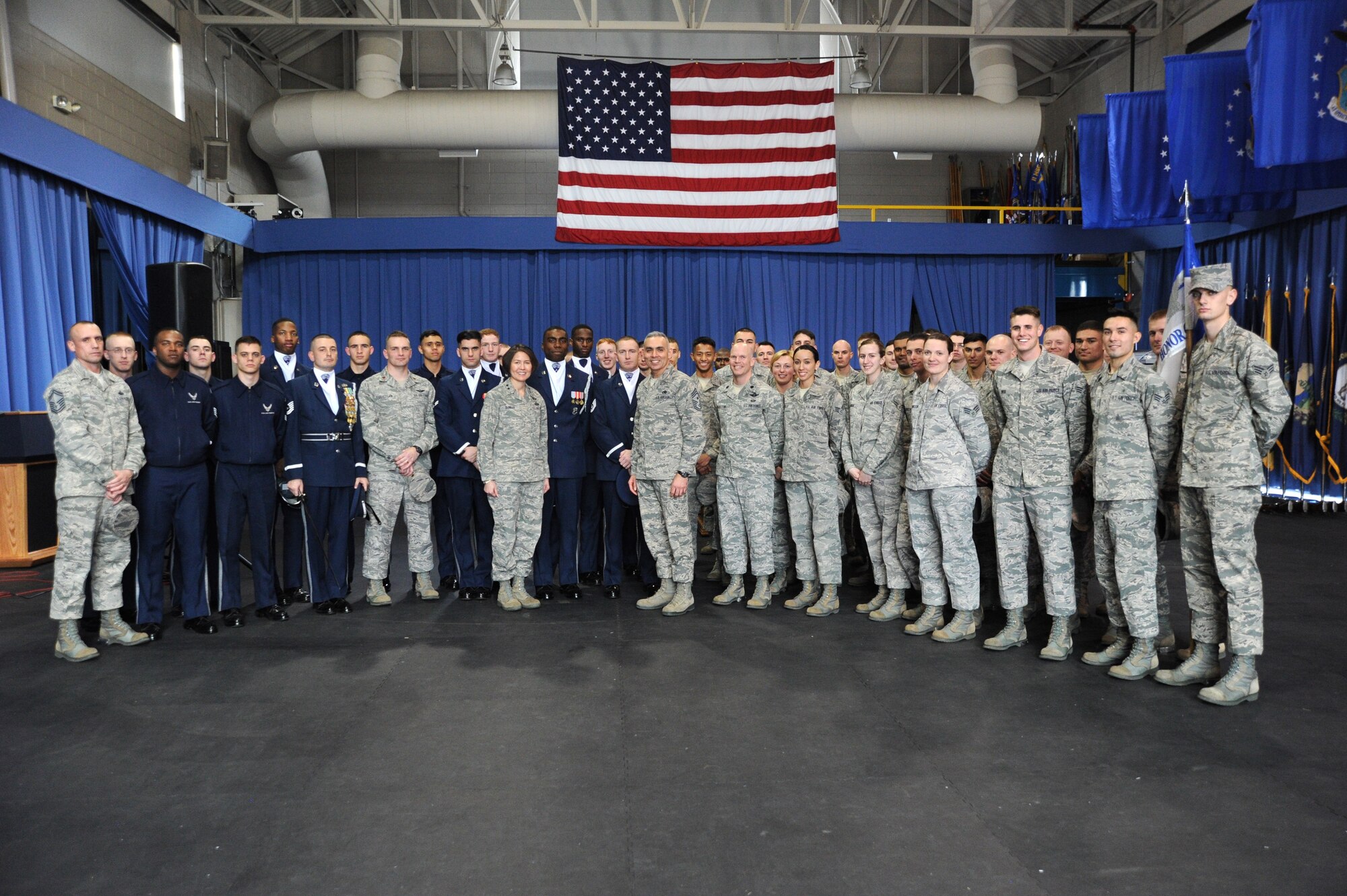 Air Force District of Washington Commander Maj. Gen. Sharon K. G. Dunbar and AFDW Command Chief Master Sgt. Jose LugoSantiago pose for a photo with members of the U.S. Air Force Honor Guard at Joint Base Anacostia-Bolling, D.C., Feb. 7, 2014. Airmen of every enlisted rank, and both company and field grade officers, volunteer and are competitively selected from their peers in more than 200 different Air Force career fields to serve in the Honor Guard. (U.S. Air Force photo/Master Sgt. Tammie Moore)