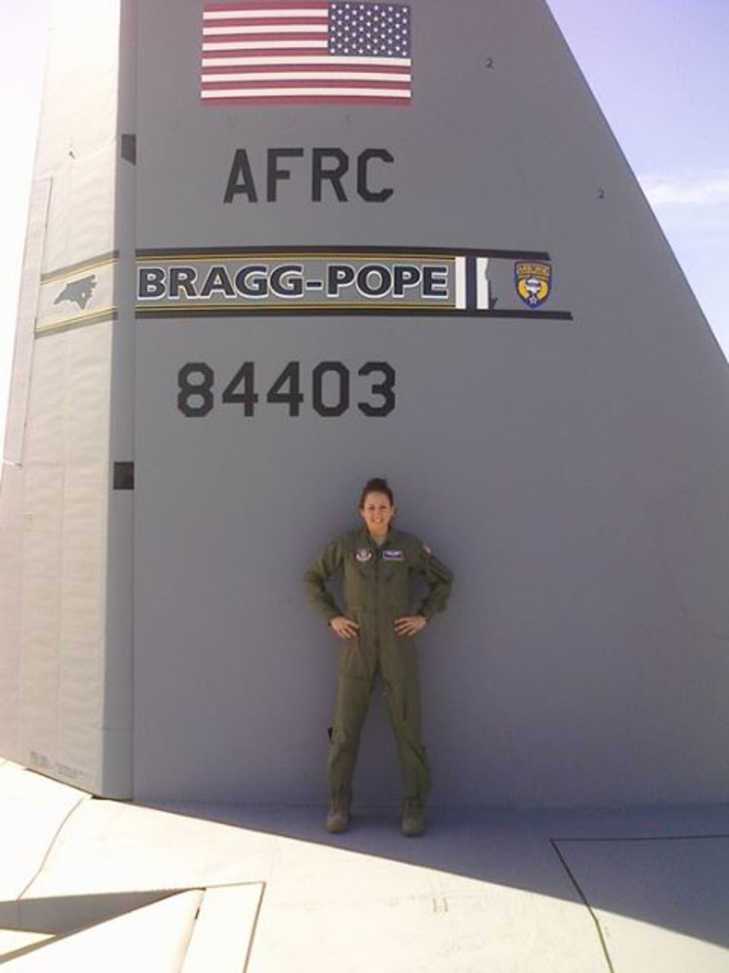 Staff Sgt. Melissa Deardorff, a flight medic with the 36th Aeromedical Evacuation Squadron, stands on the tail of a C-130.  Deardorff has been selected to play on the U.S. Air Force Europe volleyball team for a second time.  (Courtesy photo)