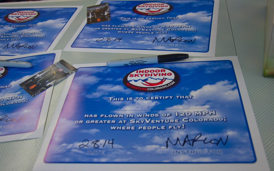 140208-F-GZ967-026 The Airmen were presented with certificates of completion after braving the extreme winds of indoor skydiving for the first time Feb. 8. 