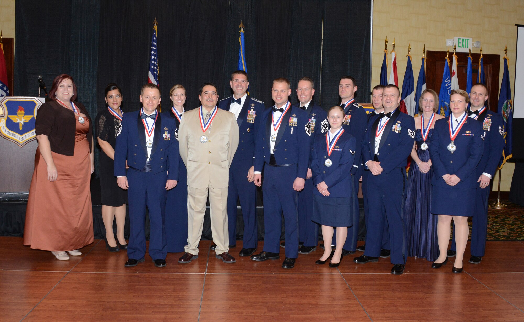 Winners of the 58th Special Operations Wing annual awards were recognized at a ceremony Feb. 8. From left to right: Vanessa Harding, Kristina Jacques, Master Sgt. Mike Sitarz, Tech. Sgt. Sarah Hall, Matthew Tafoya, Col. Vincent Becklund, Master Sgt. James Smith, Chief Master Sgt. Cory Olson, Airman 1st Class Megan Lenz, Maj. Matthew Price, Capt. Nicholas Muley, Tech. Sgt. Sean Castello, Tiffany Davis, Airman 1st Class Lisa Pliska, and Tech. Sgt. Jason Davis. (Photo by Dennis Carlson)