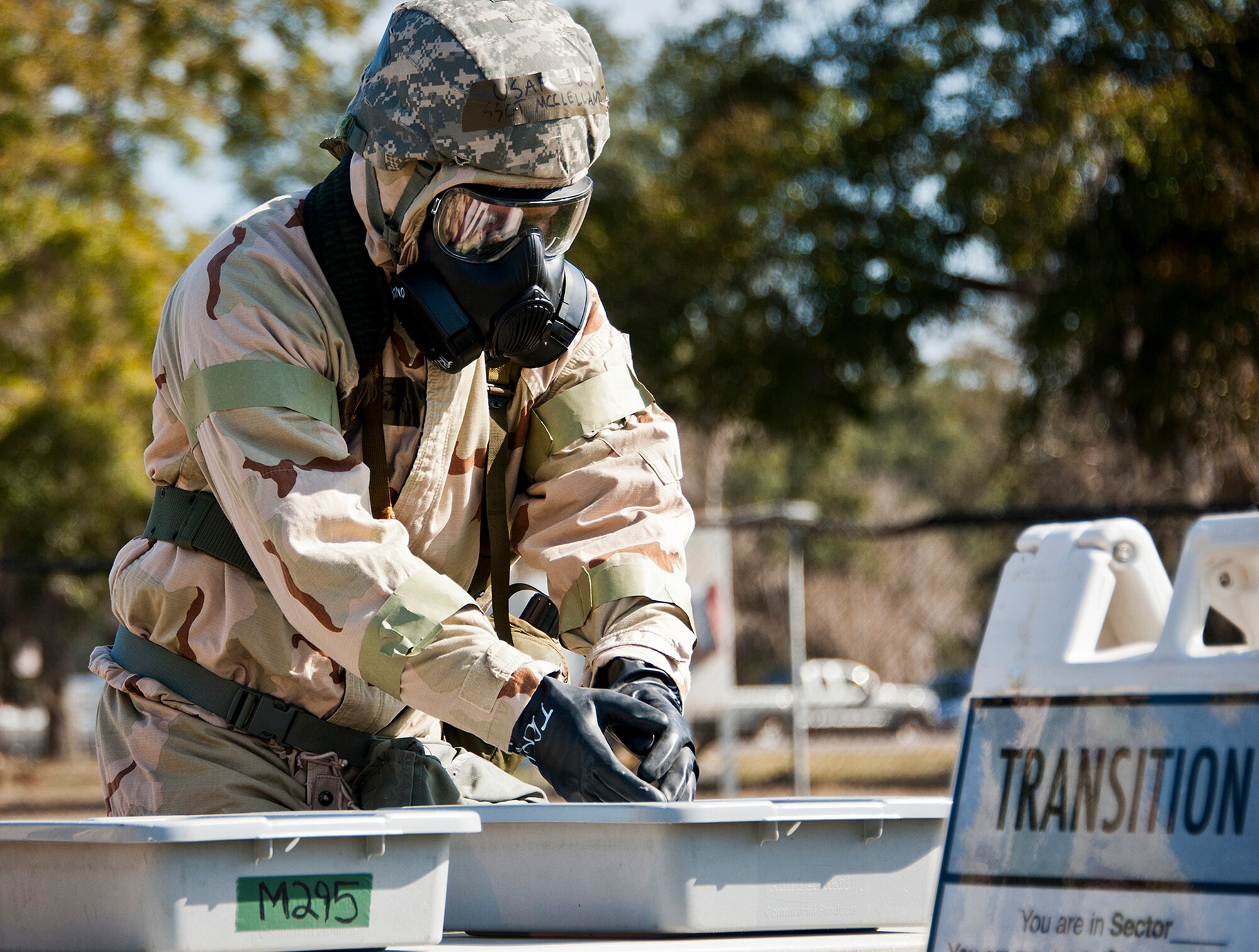 Staff Sgt. Timothy McClelland, of the 96th Medical Support Squadron, practices decontamination techniques following the final exercise in MOPP-4 gear during the field training portion of a Phase II exercise Feb. 7 at Eglin Air Force Base, Fla. A Phase II evaluates an Airman’s ability to meet wartime and contingency taskings of employing the force, sustaining the force and the ability to survive and operate. More than 70 potential deployers received the classroom and practical field training during a series of 96th Test Wing exercises occurring all week. (U.S. Air Force photo/Sara Vidoni)