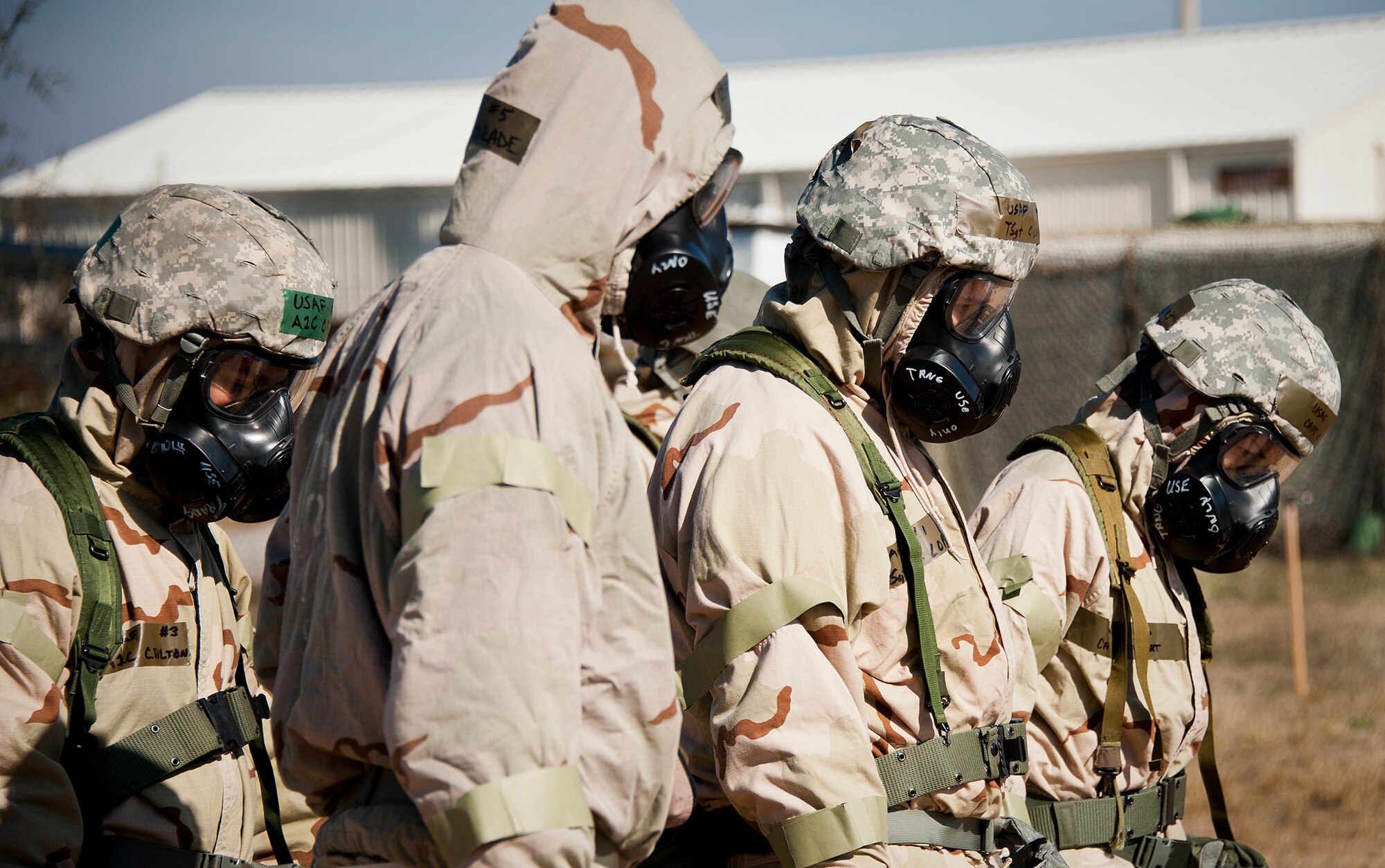 Airmen walk the perimeter of their sector searching for possible ordnance during the field training portion of a Phase II exercise Feb. 7 at Eglin Air Force Base, Fla. A Phase II evaluates an Airman’s ability to meet wartime and contingency taskings of employing the force, sustaining the force and the ability to survive and operate. More than 70 potential deployers received the classroom and practical field training during a series of 96th Test Wing exercises occurring all week. (U.S. Air Force photo/Sara Vidoni)