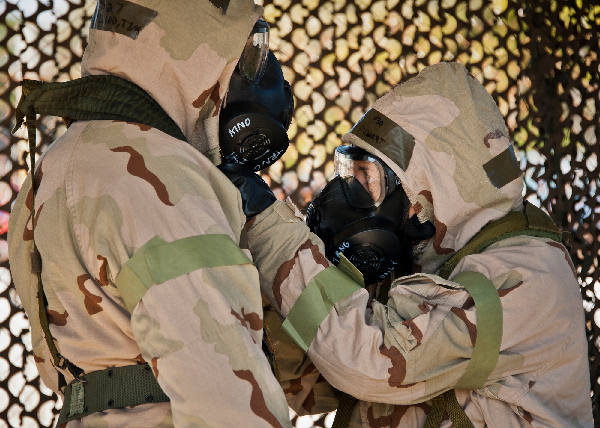 Capt. Corinne Stewart, of the 96th Medical Group, helps ensure that Staff Sgt. Timothy McClelland’s neck area is properly sealed during the field training portion of a Phase II exercise Feb. 7 at Eglin Air Force Base, Fla. A Phase II evaluates an Airman’s ability to meet wartime and contingency taskings of employing the force, sustaining the force and the ability to survive and operate. More than 70 potential deployers received the classroom and practical field training during a series of 96th Test Wing exercises occurring all week. (U.S. Air Force photo/Sara Vidoni)