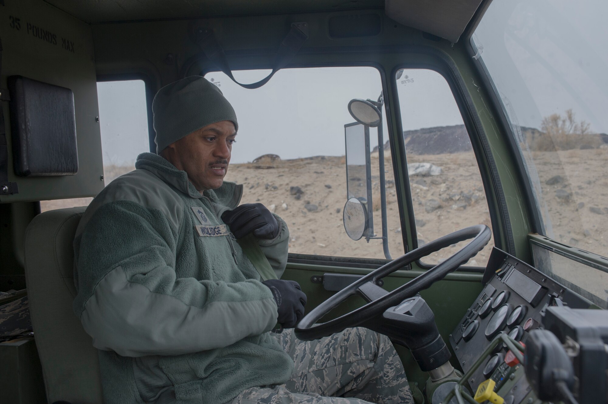 U.S. Air Force Chief Master Sgt. Avery Woolridge, 552nd Air Control Wing command chief, prepares to drive a K251 5-ton truck during a site visit with the 726th Air Control Squadron at Mountain Home Air Force Base, Idaho, Feb. 5, 2014. The visit was to familiarize the new command chief with the geographically separated unit’s capabilities. (U.S. Air Force photo by Staff Sgt. Roy Lynch/Released)