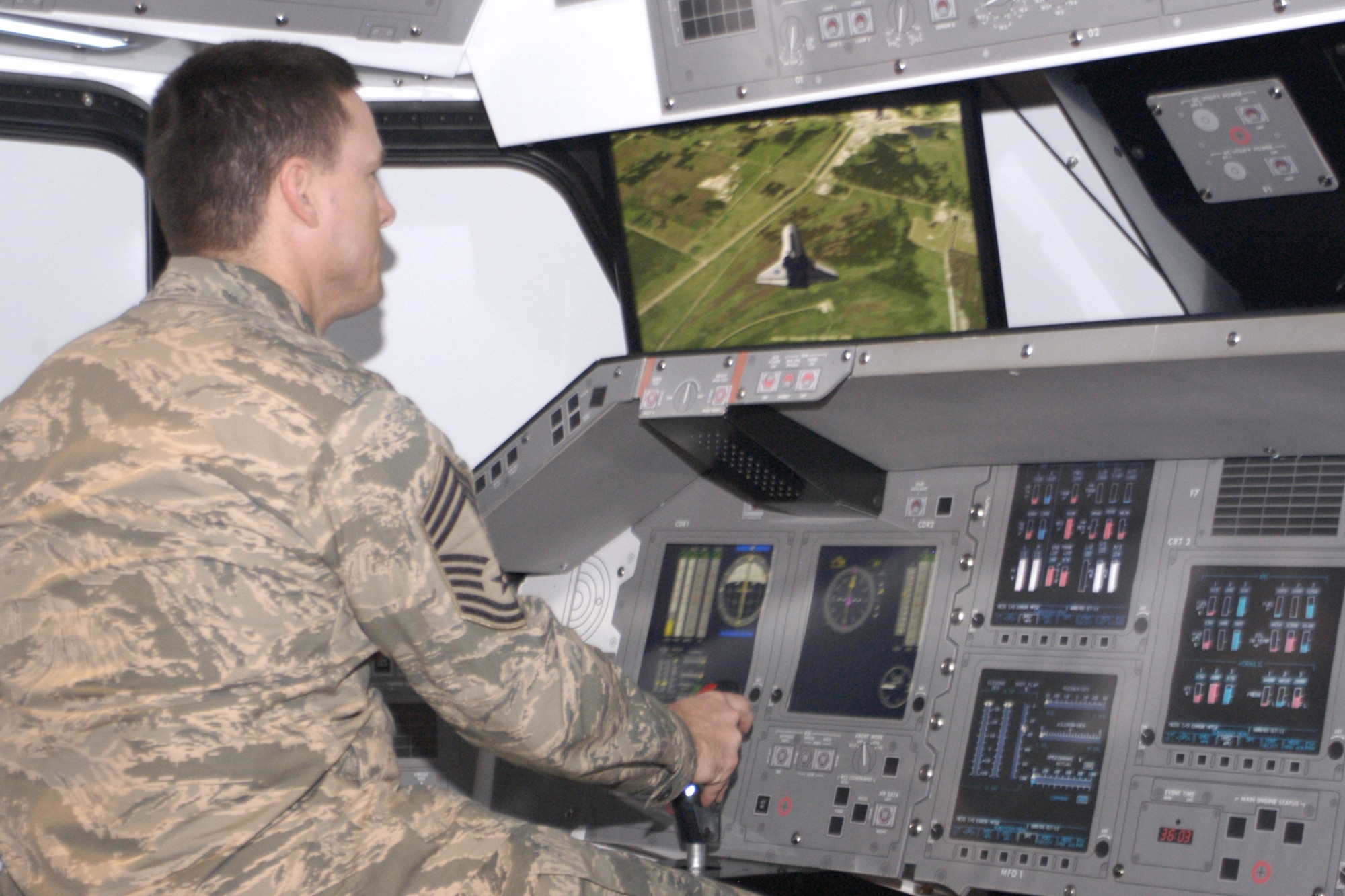 National Museum of the U.S. Air Force visitors can test their skill at landing a space shuttle orbiter with the interactive space shuttle landing simulators. The simulators are free of charge and allow visitors to “fly” the shuttle to a safe landing using a joystick and video screens, and receive feedback on how well they piloted the shuttle. (U.S. Air Force Photo)