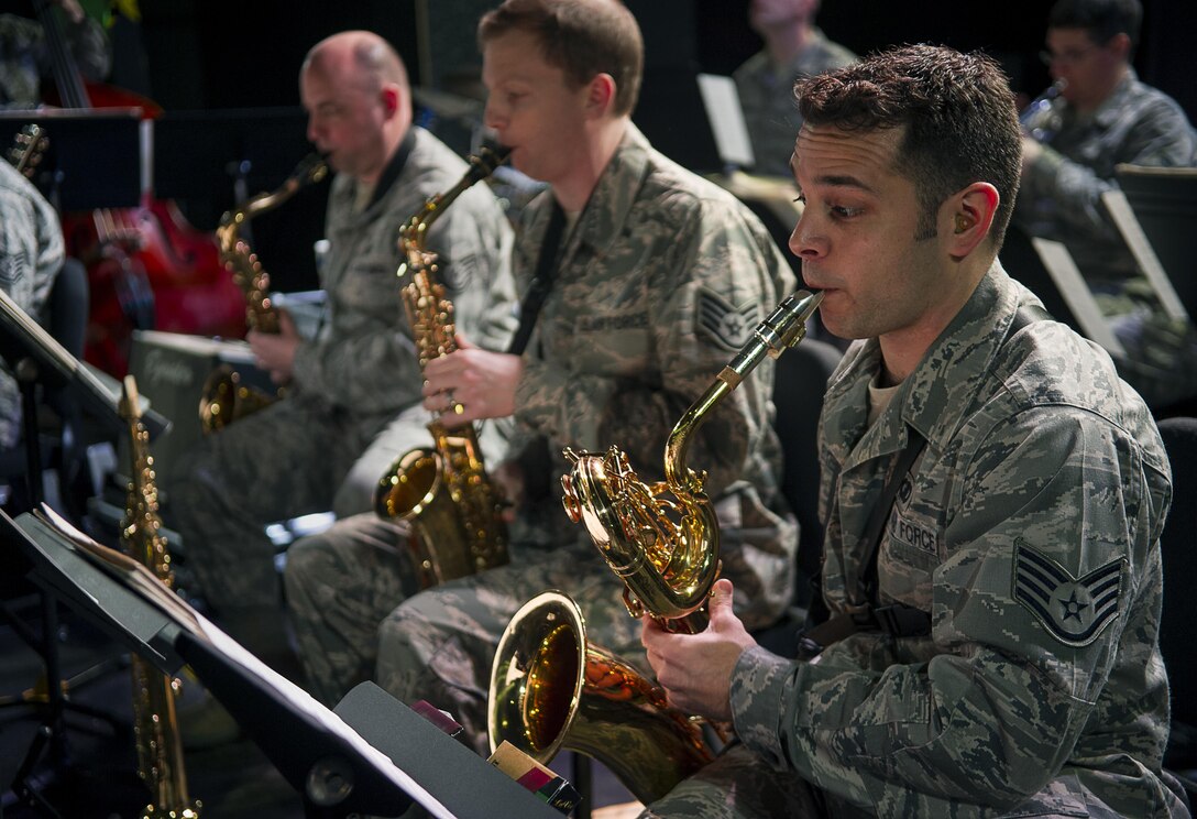RAMSTEIN AIR BASE, Germany -- Staff Sgt. Lencys Esteban-Nunez plays saxophone during a rehearsal with the U.S. Air Forces in Europe Band jazz ensemble The Ambassadors at Ramstein Air Base, Germany Jan. 16, 2014. Esteban-Nunez learned to play saxophone during his childhood in Republic of Cuba before immigrating to the United States and joining the U.S. Air Force. (U.S. Air Force photo/Tech. Sgt. Benjamin Wilson)