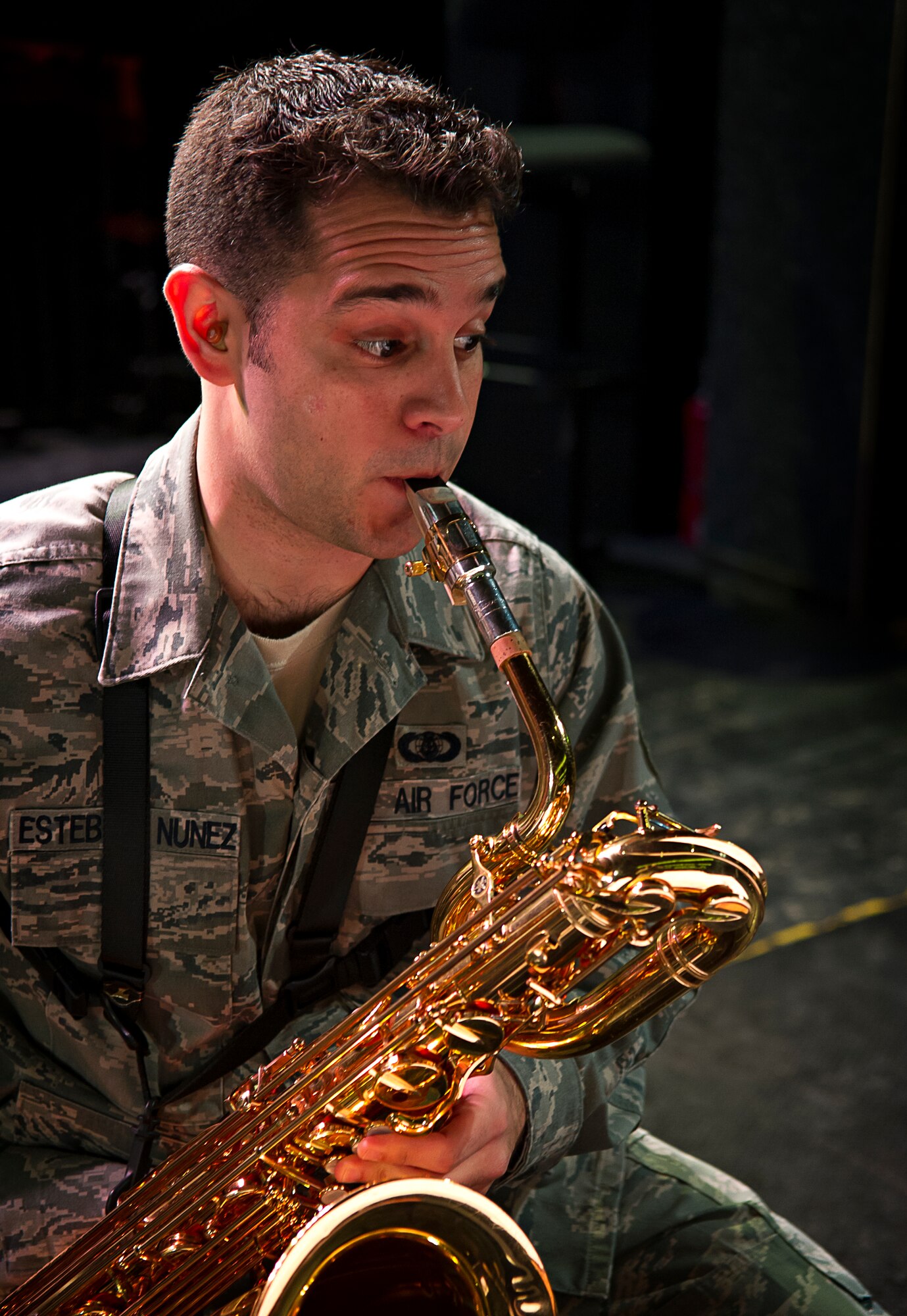 RAMSTEIN AIR BASE, Germany -- Staff Sgt. Lencys Esteban-Nunez plays saxophone during a rehearsal with the U.S. Air Forces in Europe Band jazz ensemble The Ambassadors at Ramstein Air Base, Germany Jan. 16, 2014. Esteban-Nunez learned to play saxophone during his childhood in Republic of Cuba before immigrating to the United States and joining the U.S. Air Force. (U.S. Air Force photo/Tech. Sgt. Benjamin Wilson)