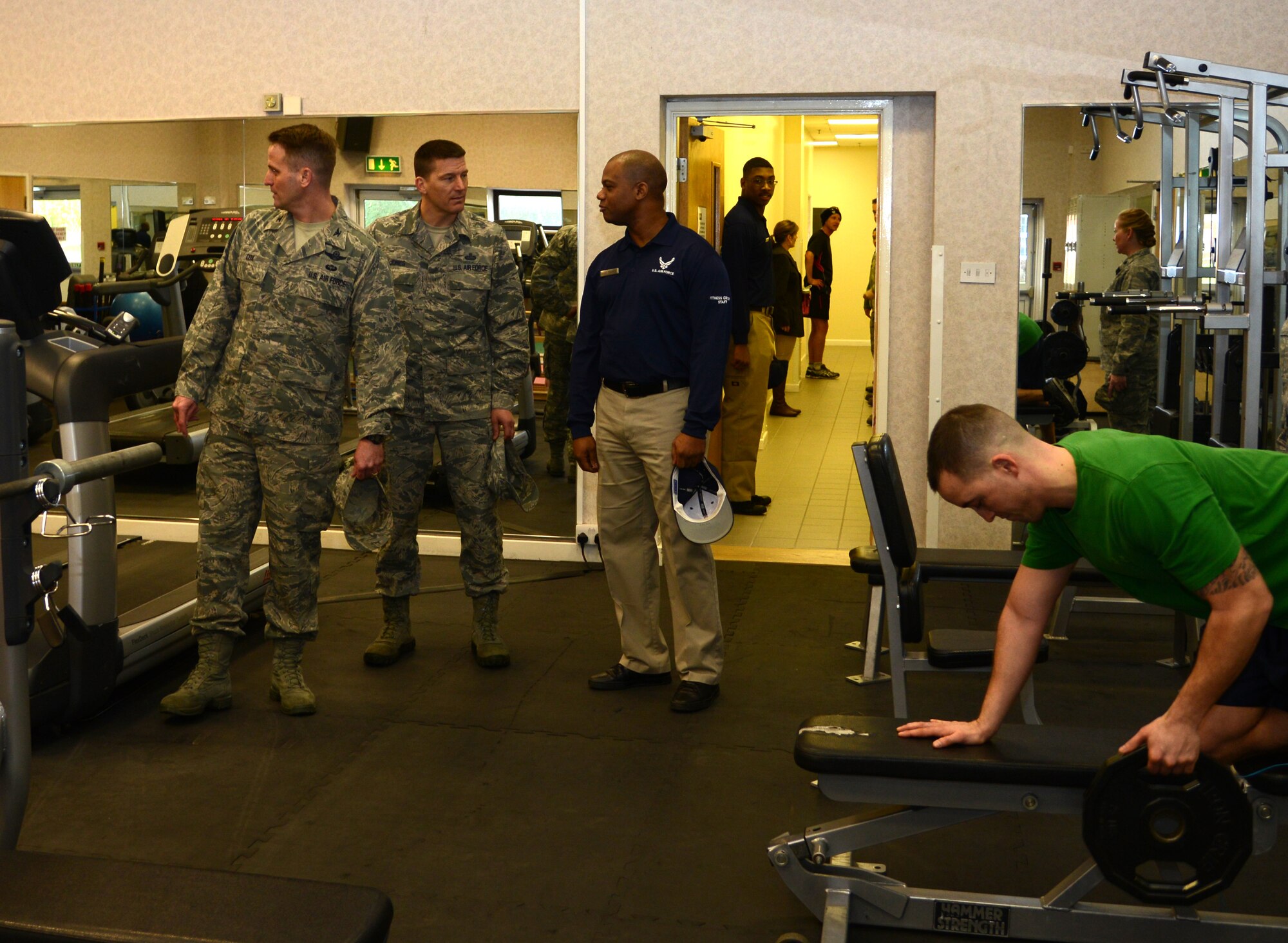 U.S. Air Force Col. David Cox, 100th Air Refueling Wing vice commander, left, and U.S. Air Force Chief Master Sgt. Tracy Jones, 100th Air Refueling Wing command chief, center, tour the parent area of the Northside Fitness Center, with U.S. Air Force Master Sgt. Michael Francis, 100th Force Support Squadron fitness superintendent from Kingston, Jamaica, Feb. 3, 2014, on RAF Mildenhall, England. The fitness center closed for remodeling in November 2013. The center received new paint, expansion to the parent area and new tiling. (U.S. Air Force photo by Airman 1st Class Kelsey Waters/Released)