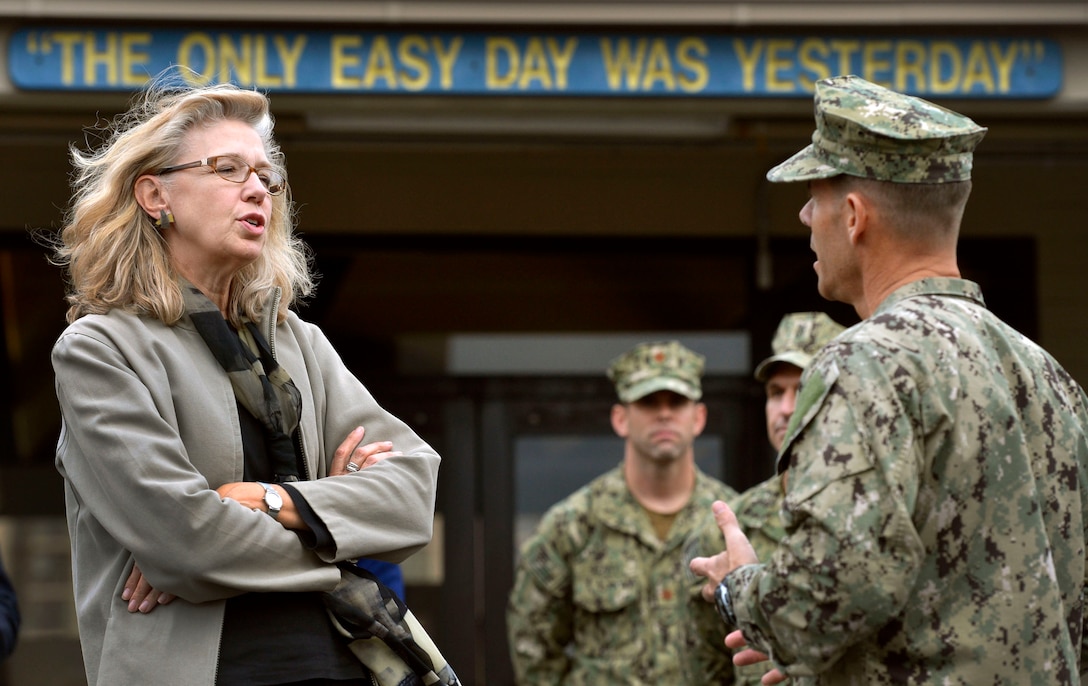 Acting Deputy Defense Secretary Christine H. Fox gets a briefing from Navy Capt. Keith Davids, commanding officer of the Navy Special Warfare Center, before viewing Navy SEAL training exercises in San Diego, Feb. 10, 2014. 
