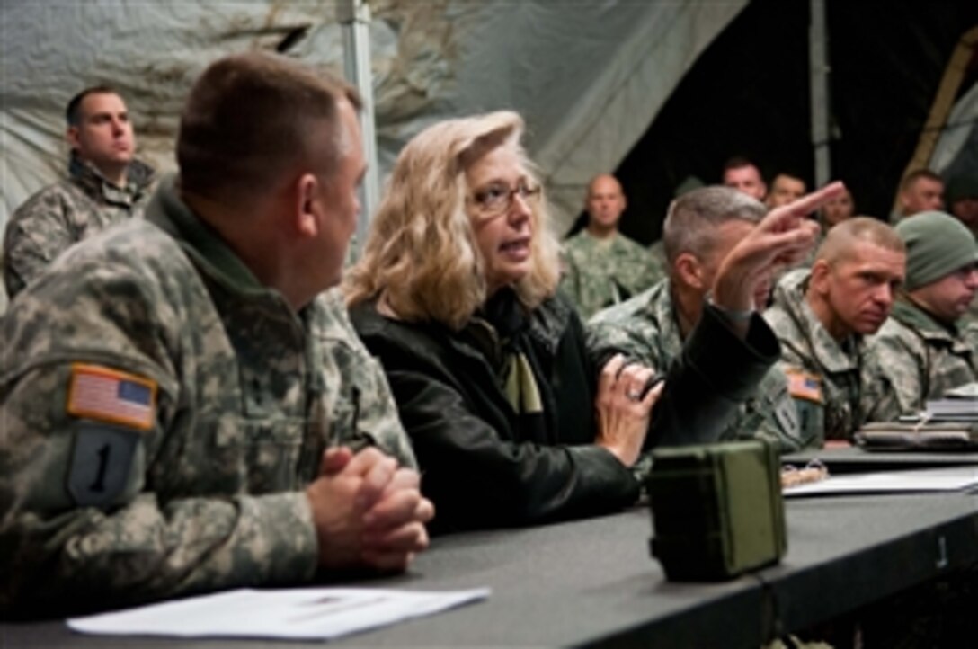Acting Deputy Defense Secretary Christine H. Fox comments as she observes training on Fort Riley, Kan., Feb. 10, 2014.
