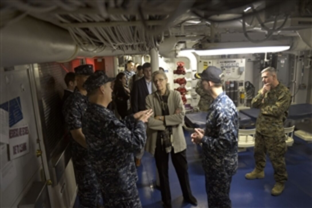 Acting Deputy Defense Secretary Christine H. Fox gets a briefing in the galley of the USS Freedom while touring the Navy's ship in San Diego, Feb. 10, 2014. Fox, who is on a two-day trip, visited Fort Riley, Kan., earlier in the day to observe training and tactical operations.