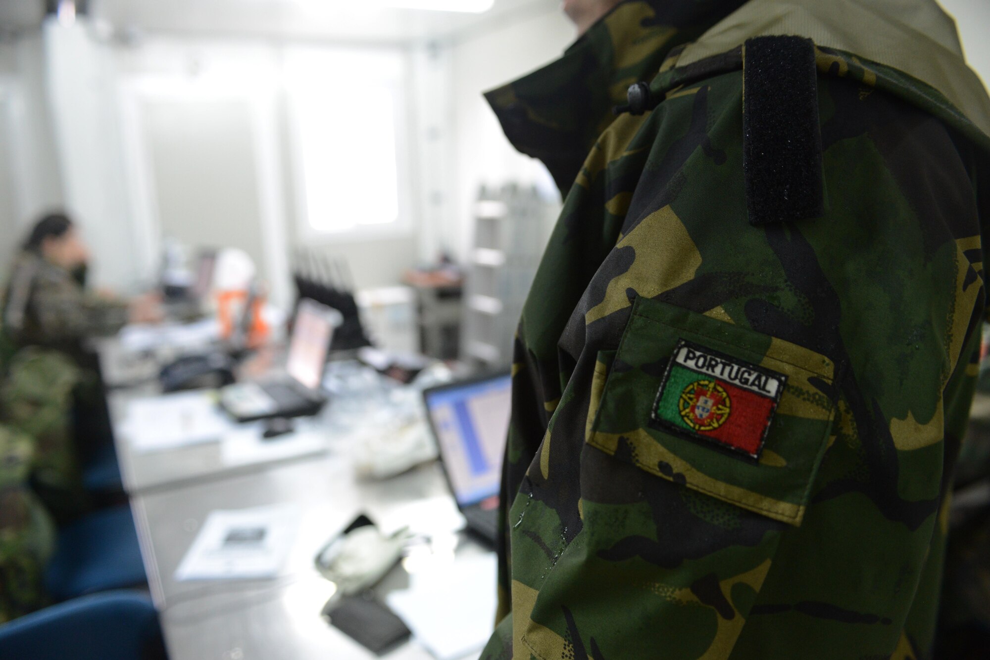 A patch of the Portuguese flag is worn by a Portuguese maintainer during Real Thaw 14, an international exercise at Monte Real Air Base, Portugal. For many maintainers, Real Thaw 14 is the first opportunity to work alongside other NATO countries outside the walls of Aviano Air Base. U.S. Air Force photo/2nd Lt. Allie Delury).