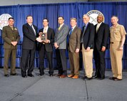 From left, Brig. Gen. Kevin Nally, deputy chief information officer for the Marine Corps; Terry Halvorsen, Department of the Navy chief information officer; and Vice Adm. Ted Branch (far right), deputy chief of Naval Operations for Information Dominance and director of Naval Intelligence, present the DON Information Management-Information Technology Excellence Award to the DON Next-Generation Enterprise Network Contract Source Selection Team. The Navy/Marine Corps team supported the successful evaluation and award of the multi-billion-dollar NGEN contract. The award was presented Feb. 11 in San Diego during AFCEA West.