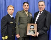 Cmdr. Ross Orvik (left), acquisition team lead; Brig. Gen. Kevin Nally, deputy chief information officer for the Marine Corps; and Stephen Cabrian, of Marine Corps Systems Command, display the Department of the Navy Information Management-Information Technology Excellence Award. The Navy/Marine Corps was recognized for saving the Department millions through enterprise license agreements which maintain commercial software across the DON. The award was presented Feb. 11 in San Diego AFCEA West. 