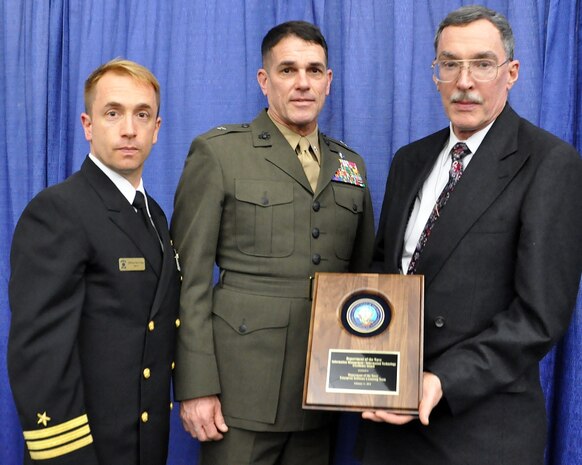 Cmdr. Ross Orvik (left), acquisition team lead; Brig. Gen. Kevin Nally, deputy chief information officer for the Marine Corps; and Stephen Cabrian, of Marine Corps Systems Command, display the Department of the Navy Information Management-Information Technology Excellence Award. The Navy/Marine Corps was recognized for saving the Department millions through enterprise license agreements which maintain commercial software across the DON. The award was presented Feb. 11 in San Diego AFCEA West. 